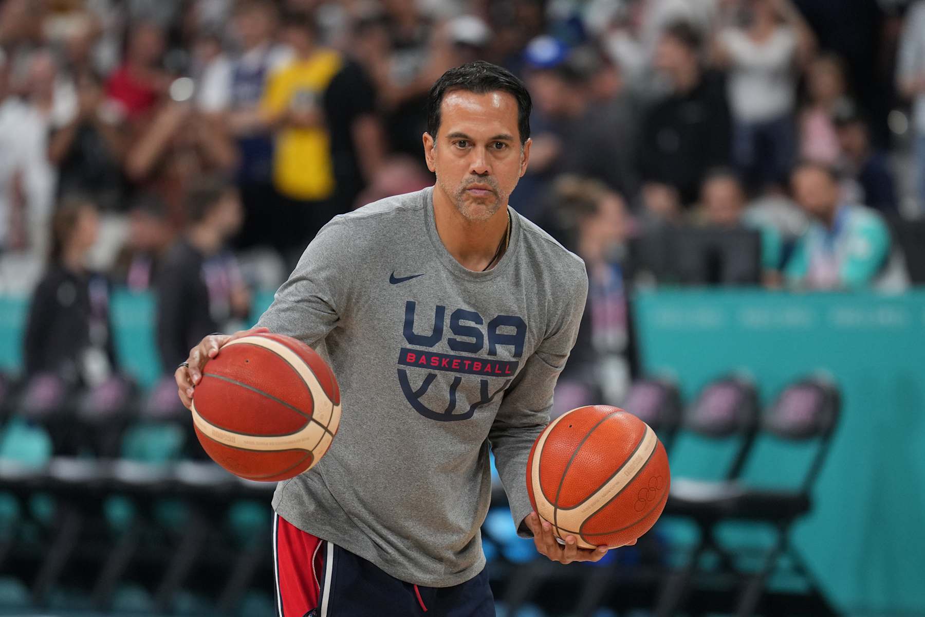 LILLE, FRANCE - JULY 31:  Assistant Coach Erik Spoelstra of the USA Basketball Men's Team passes the ball before the game on July 31, 2024 at the Stade Pierre Mauroy in Paris, France. NOTE TO USER: User expressly acknowledges and agrees that, by downloading and/or using this photograph, user is consenting to the terms and conditions of the Getty Images License Agreement. Mandatory Copyright Notice: Copyright 2024 NBAE (Photo by Jesse D. Garrabrant/NBAE via Getty Images)