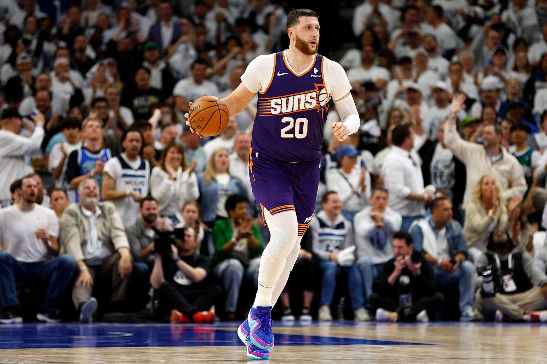 MINNEAPOLIS, MINNESOTA - APRIL 23: Jusuf Nurkic #20 of the Phoenix Suns dribbles the ball against the Minnesota Timberwolves in the fourth quarter of game two of the Western Conference First Round Playoffs at Target Center on April 23, 2024 in Minneapolis, Minnesota. The Timberwolves defeated the Sun 105-93. NOTE TO USER: User expressly acknowledges and agrees that, by downloading and or using this photograph, User is consenting to the terms and conditions of the Getty Images License Agreement. (Photo by David Berding/Getty Images)