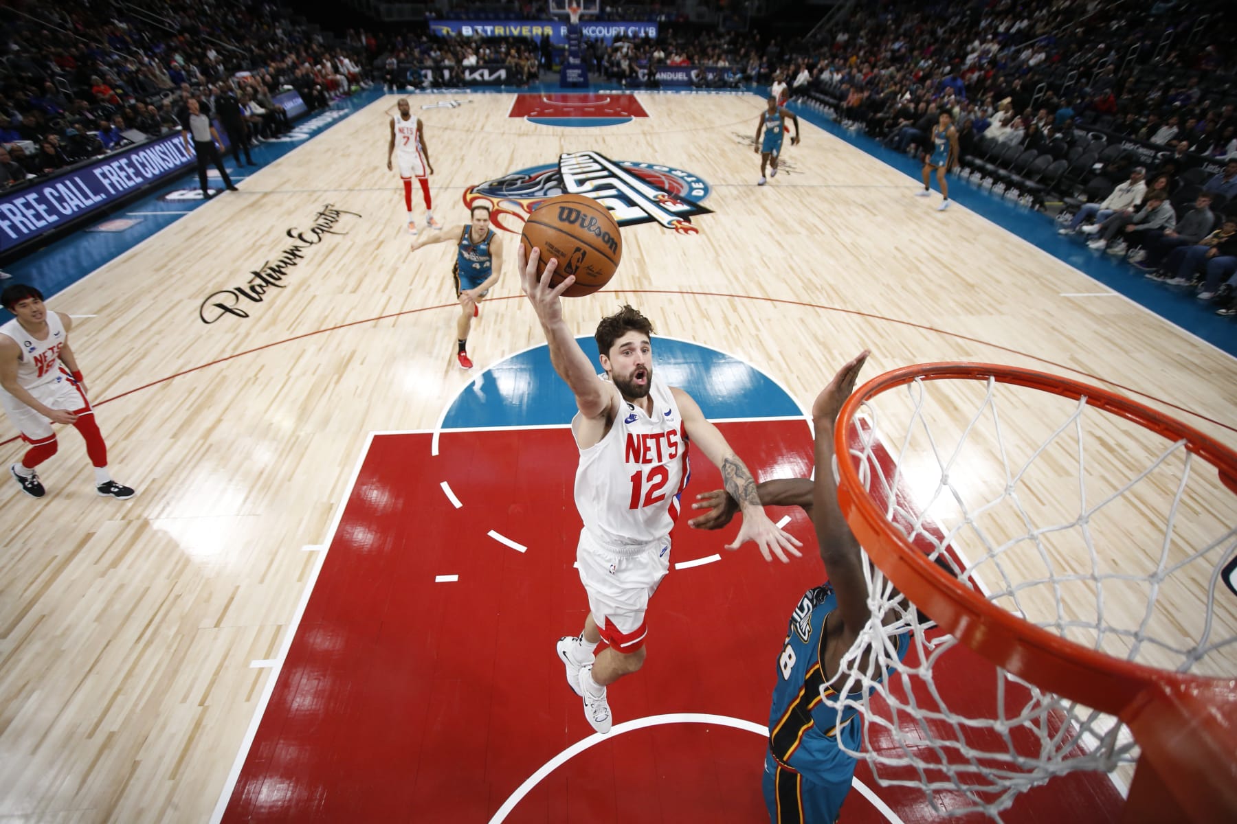 DETROIT, MI - DECEMBER 18:  Joe Harris #12 of the Brooklyn Nets drives to the basket during the game against the Detroit Pistons on December 18, 2022 at Little Caesars Arena in Detroit, Michigan. NOTE TO USER: User expressly acknowledges and agrees that, by downloading and/or using this photograph, User is consenting to the terms and conditions of the Getty Images License Agreement. Mandatory Copyright Notice: Copyright 2022 NBAE (Photo by Brian Sevald/NBAE via Getty Images)
