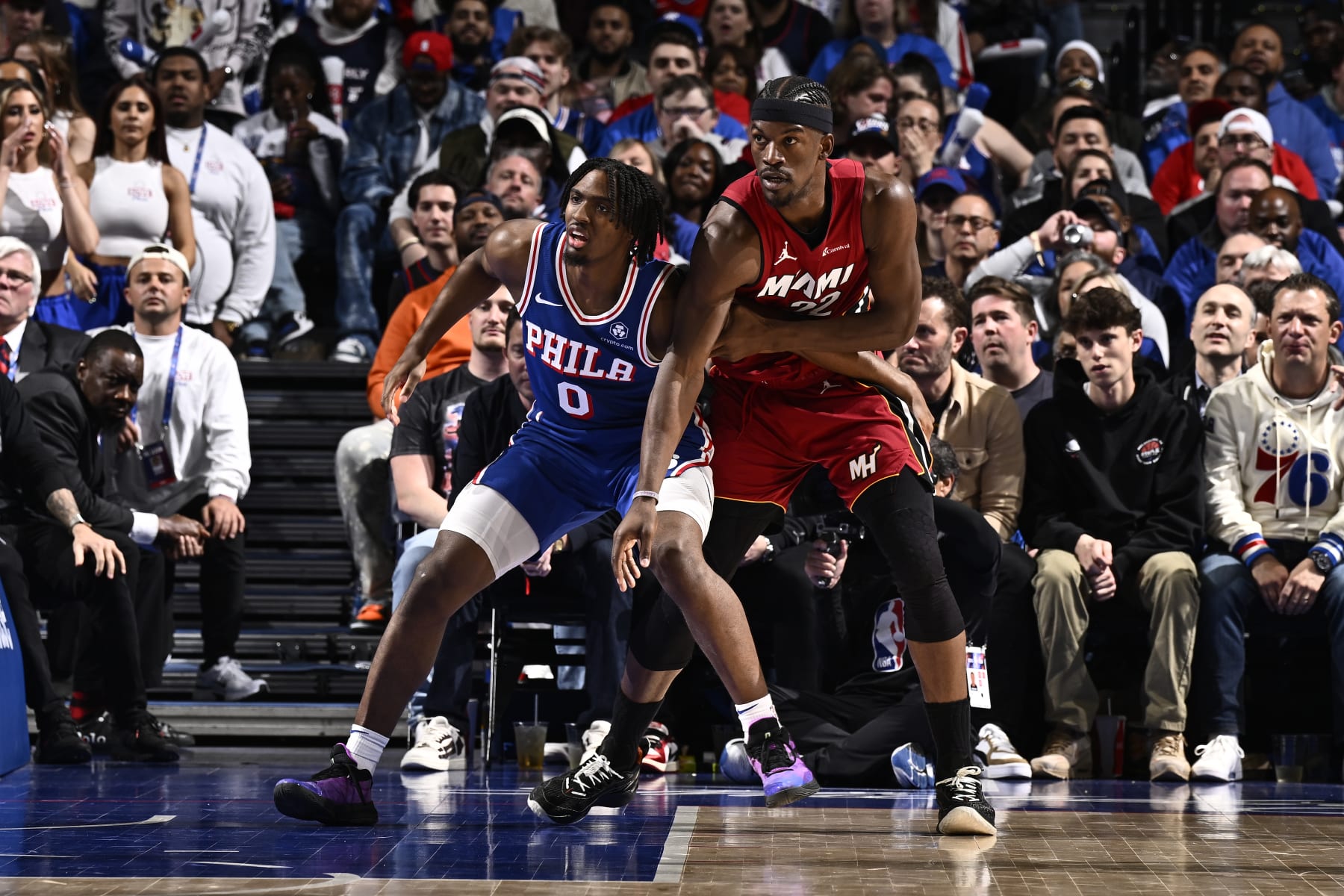 PHILADELPHIA, PA - APRIL 17:  Tyrese Maxey #0 of the Philadelphia 76ers and Jimmy Butler #22 of the Miami Heat battle for position during the 2024 NBA Play-In Tournament on April 17, 2024 at the Wells Fargo Center in Philadelphia, Pennsylvania NOTE TO USER: User expressly acknowledges and agrees that, by downloading and/or using this Photograph, user is consenting to the terms and conditions of the Getty Images License Agreement. Mandatory Copyright Notice: Copyright 2024 NBAE (Photo by David Dow/NBAE via Getty Images)