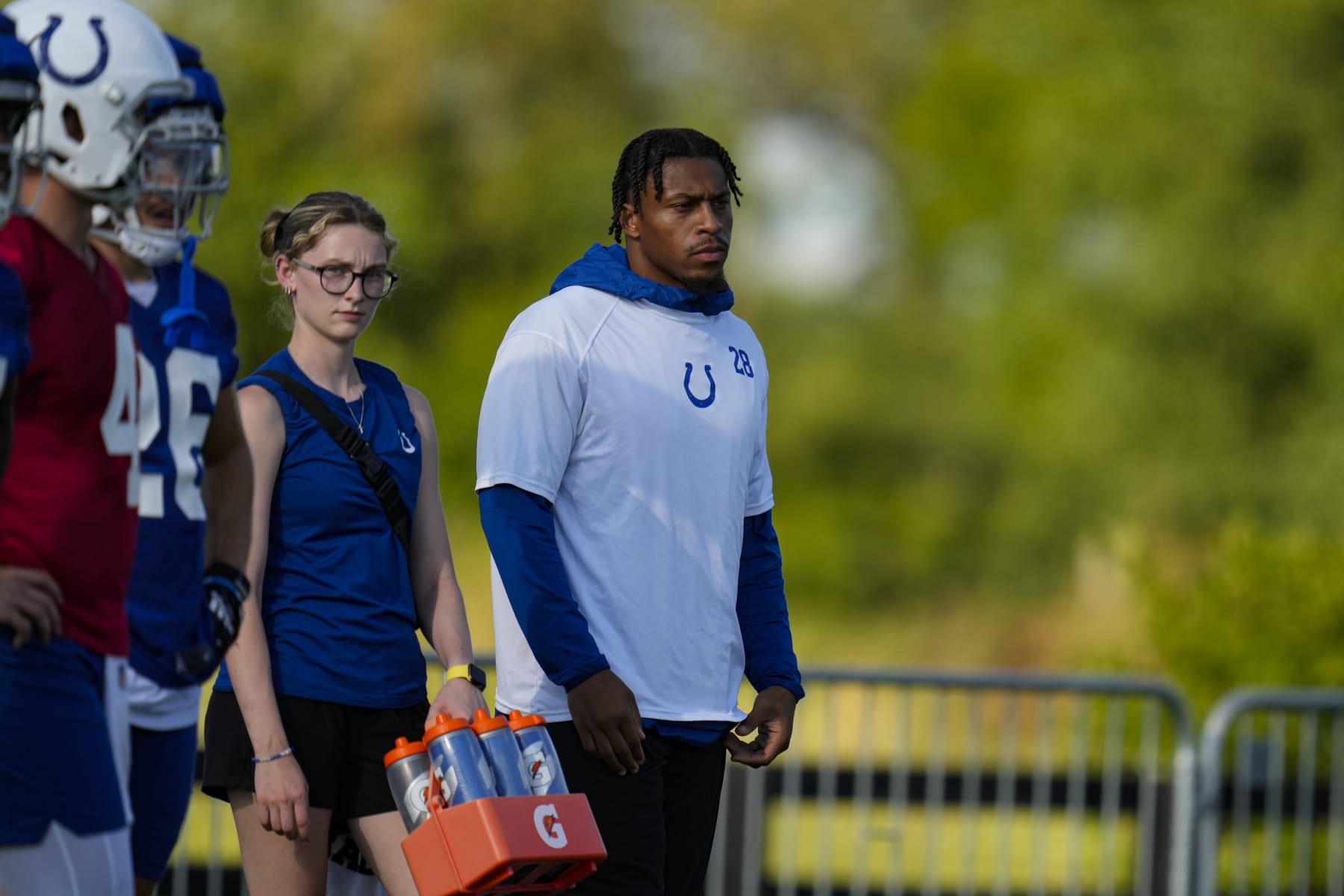 Indianapolis Colts running back Jonathan Taylor watches practice at NFL team's football training camp in Westfield, Ind., Saturday, July 29, 2023. (AP Photo/Michael Conroy)