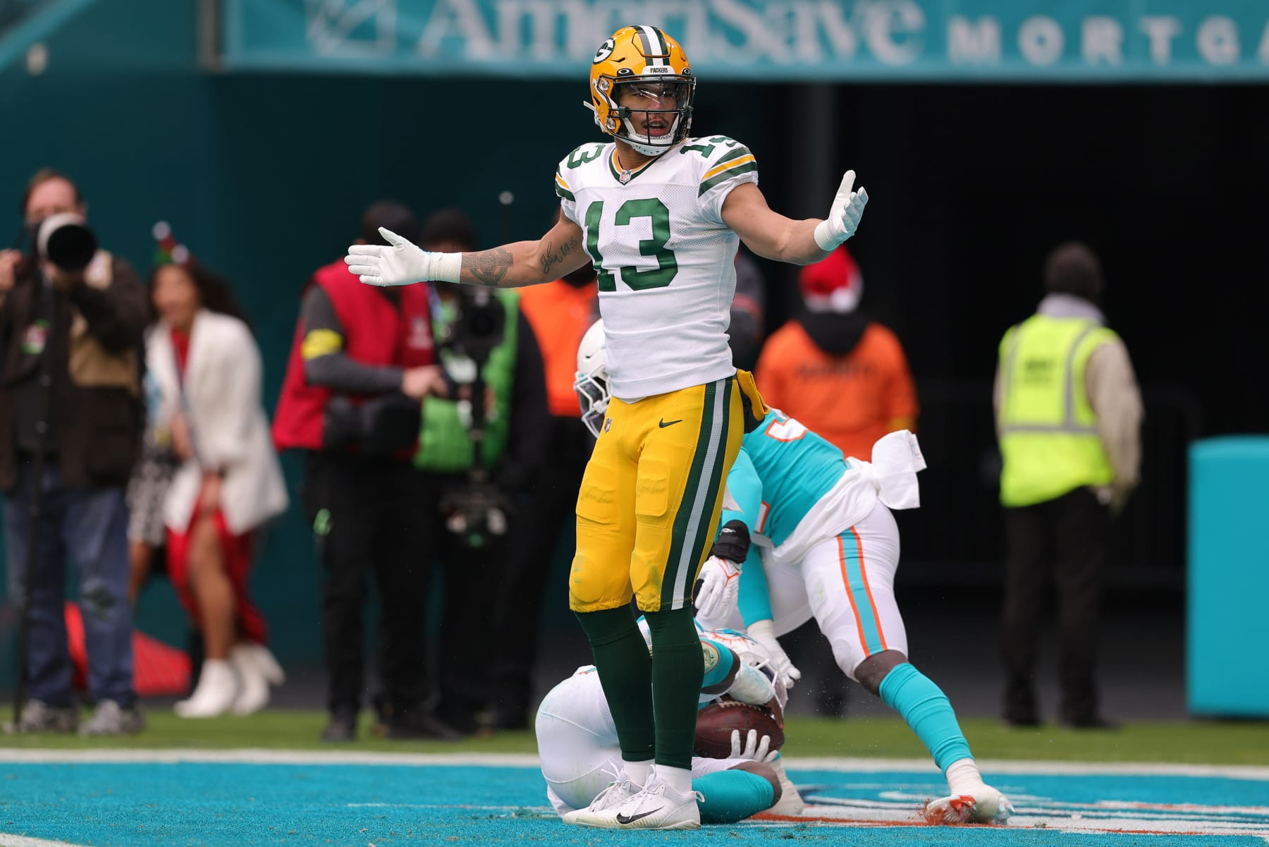 MIAMI GARDENS, FLORIDA - DECEMBER 25: Allen Lazard #13 of the Green Bay Packers reacts after Kader Kohou #28 of the Miami Dolphins intercepts a pass intended for Lazard in the fourth quarter of the game at Hard Rock Stadium on December 25, 2022 in Miami Gardens, Florida. (Photo by Megan Briggs/Getty Images)