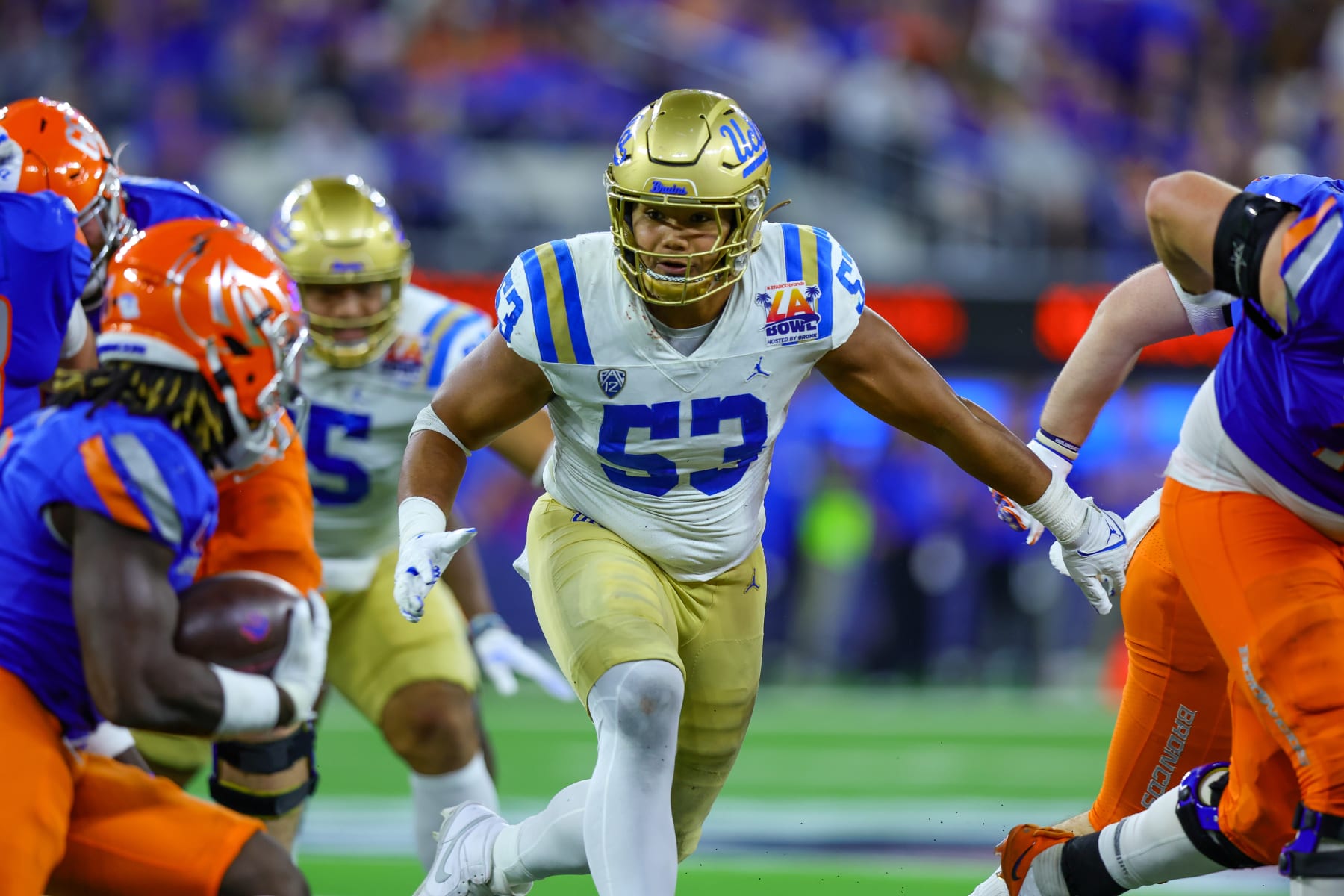 INGLEWOOD, CA - DECEMBER 16: UCLA Bruins linebacker Darius Muasau (53)  during the game between the UCLA Bruins and the Boise State Broncos for the Starco Brands LA Bowl on December 16, 2023, at SoFi Stadium in Inglewood, CA. (Photo by Jordon Kelly/Icon Sportswire via Getty Images)