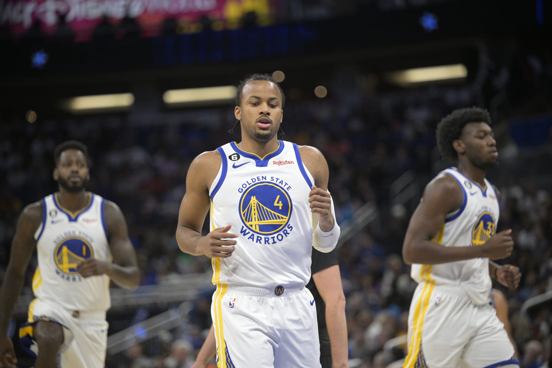 Golden State Warriors forward JaMychal Green (1), guard Moses Moody (4) and center James Wiseman (33) set up on the court during the first half of an NBA basketball game against the Orlando Magic, Thursday, Nov. 3, 2022, in Orlando, Fla. (AP Photo/Phelan M. Ebenhack)