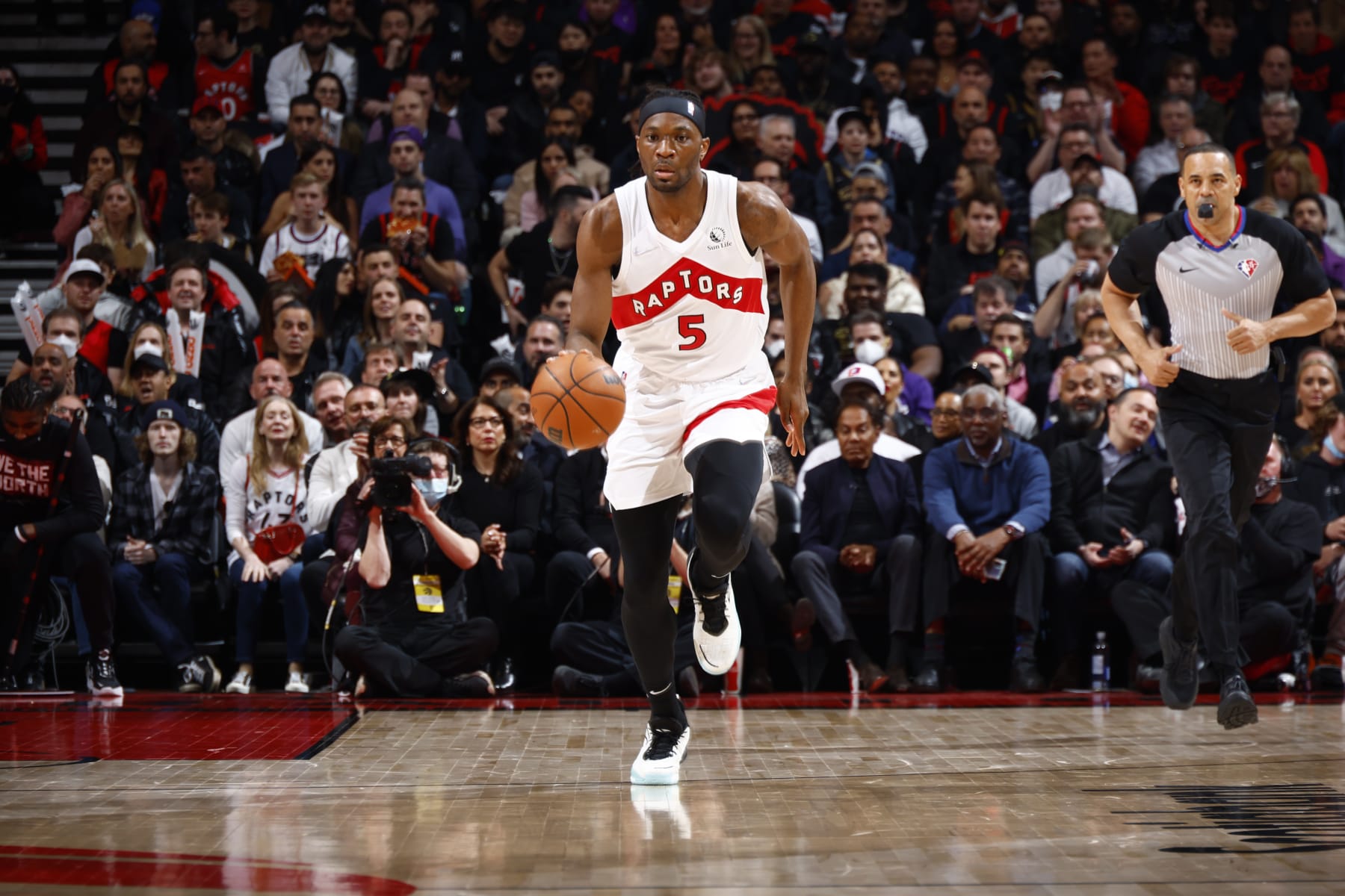 TORONTO, CANADA - APRIL 28: Precious Achiuwa #5 of the Toronto Raptors dribbles the ball during the game against the Philadelphia 76ers during Round 1 Game 6 of the 2022 NBA Playoffs on April 28, 2022 at the Scotiabank Arena in Toronto, Ontario, Canada.  NOTE TO USER: User expressly acknowledges and agrees that, by downloading and or using this Photograph, user is consenting to the terms and conditions of the Getty Images License Agreement.  Mandatory Copyright Notice: Copyright 2022 NBAE (Photo by Vaughn Ridley/NBAE via Getty Images)