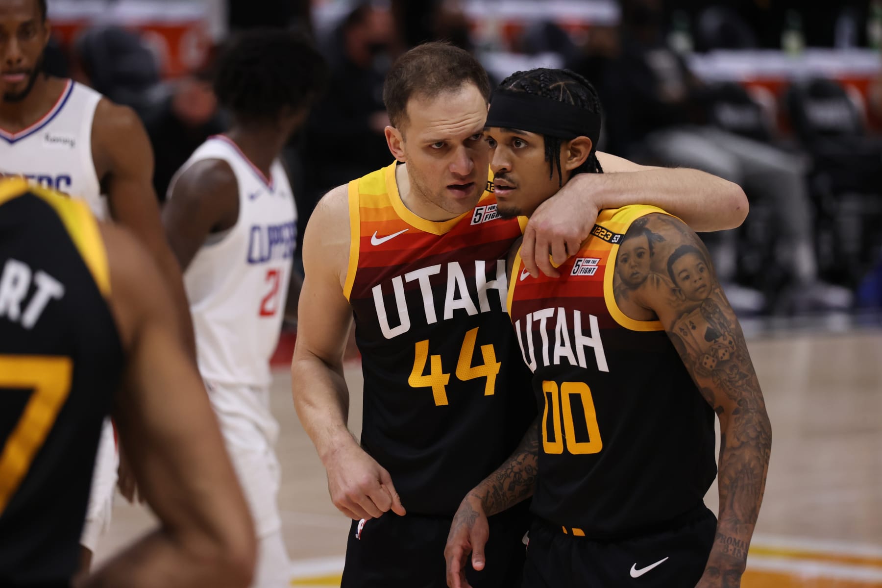 SALT LAKE CITY, UT - JUNE 10: Bojan Bogdanovic #44 of the Utah Jazz puts his arm around teammate Jordan Clarkson #00 during the game against the LA Clippers during Round 2, Game 2 of the 2021 NBA Playoffs on June 10, 2021 at vivint.SmartHome Arena in Salt Lake City, Utah. NOTE TO USER: User expressly acknowledges and agrees that, by downloading and or using this Photograph, User is consenting to the terms and conditions of the Getty Images License Agreement. Mandatory Copyright Notice: Copyright 2021 NBAE (Photo by Melissa Majchrzak/NBAE via Getty Images)
