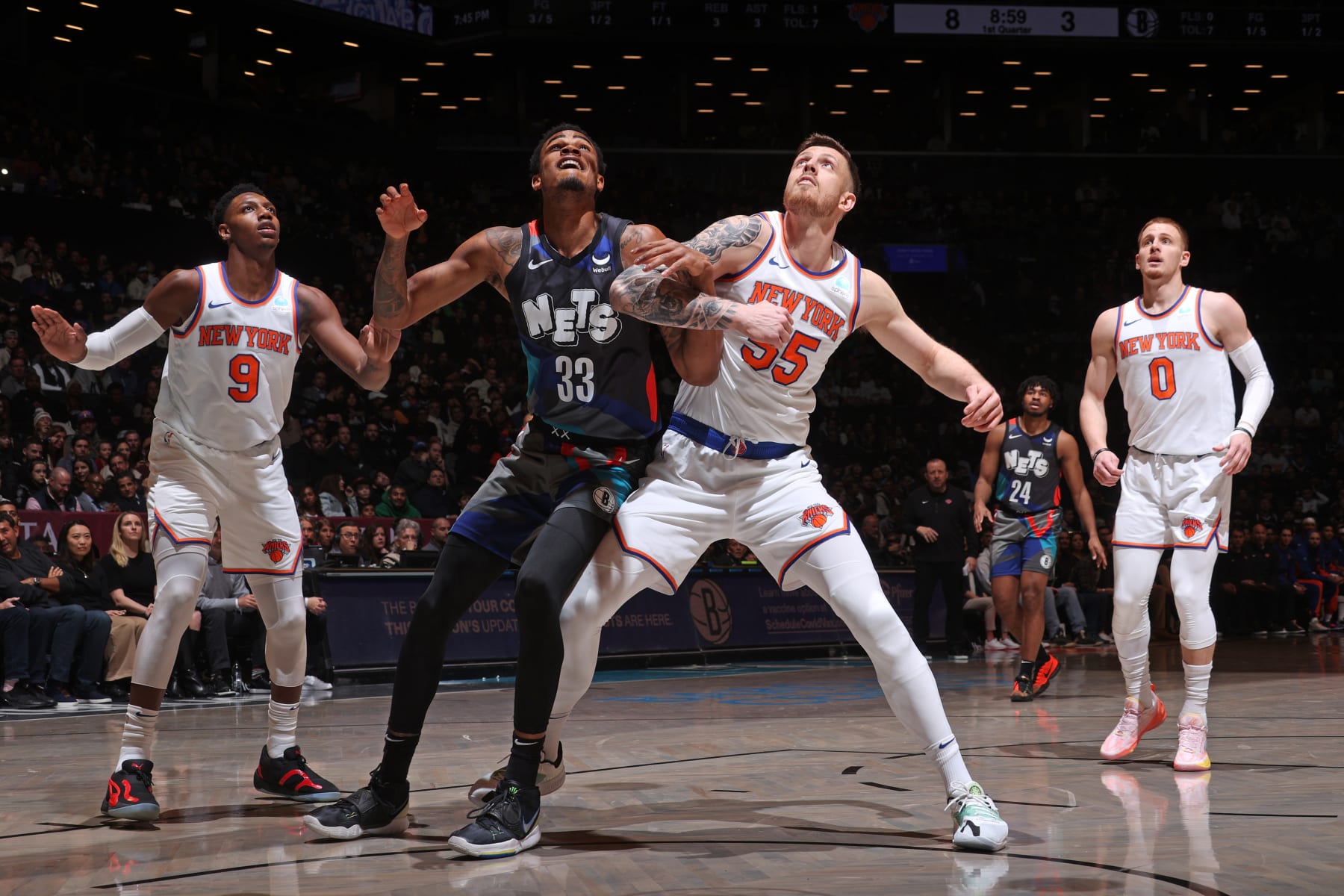 BROOKLYN, NY - DECEMBER 20: Nicolas Claxton #33 of the Brooklyn Nets and Isaiah Hartenstein #55 of the New York Knicks wait for a rebound during the game on December 20, 2023 at Barclays Center in Brooklyn, New York. NOTE TO USER: User expressly acknowledges and agrees that, by downloading and or using this Photograph, user is consenting to the terms and conditions of the Getty Images License Agreement. Mandatory Copyright Notice: Copyright 2023 NBAE (Photo by Nathaniel S. Butler/NBAE via Getty Images)