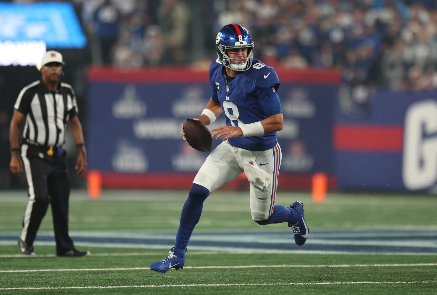 EAST RUTHERFORD, NEW JERSEY - SEPTEMBER 10: Daniel Jones #8 of the New York Giants runs with the ball during the first quarter against the Dallas Cowboys at MetLife Stadium on September 10, 2023 in East Rutherford, New Jersey. (Photo by Tim Nwachukwu/Getty Images)