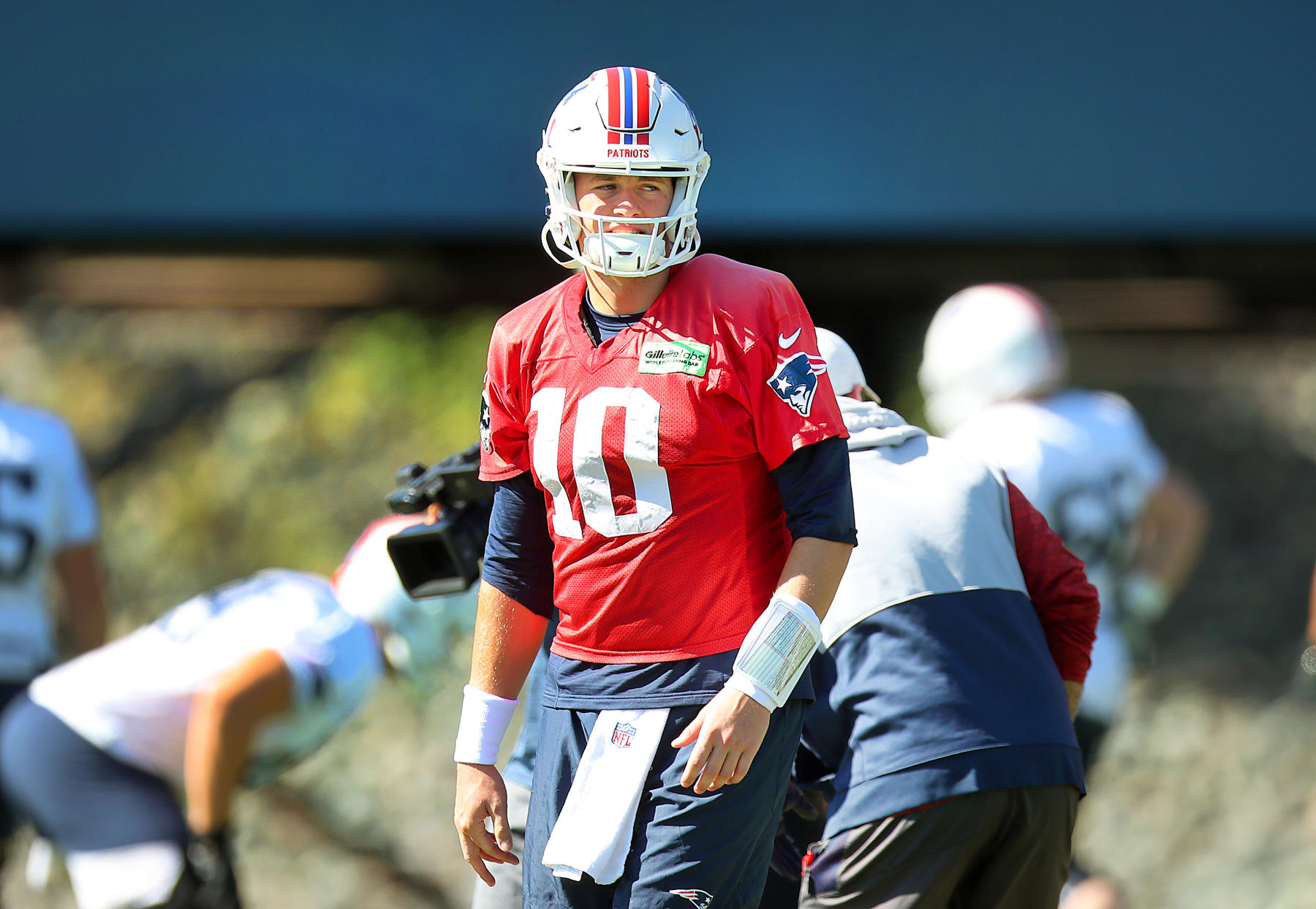Foxborough, MA - October 6: New England Patriots QB Mac Jones looks on during a passing drill. (Photo by John Tlumacki/The Boston Globe via Getty Images)