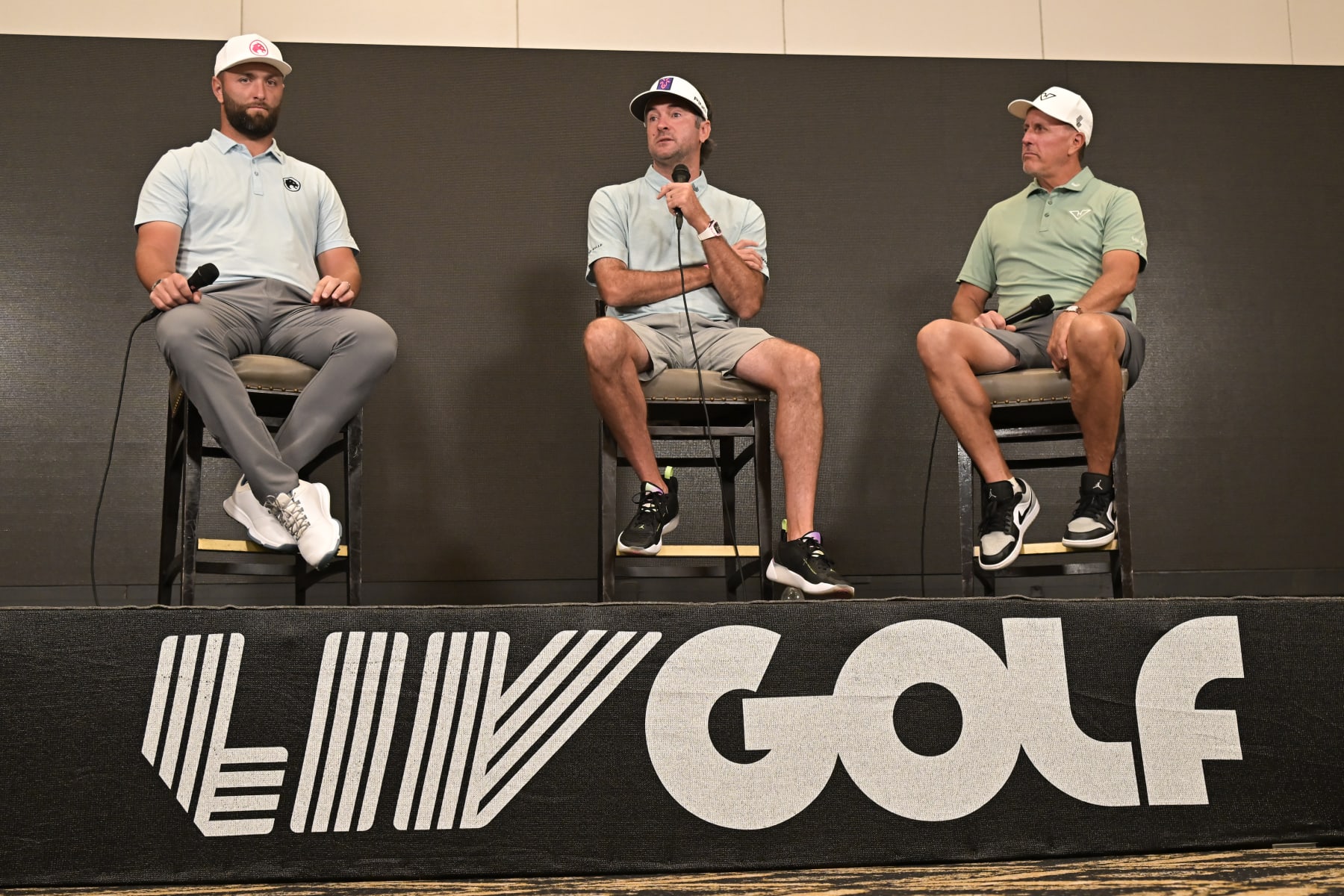 DORAL, FL - APRIL 03: Professional golfer John Rahm, from left, Bubba Watson and Phil Mickelson take questions from the media during a press conference at LIV Golf Miami on April 3, 2024, at Trump National Doral Miami in Doral, FL. (Photo by Michele Eve Sandberg/Icon Sportswire via Getty Images)