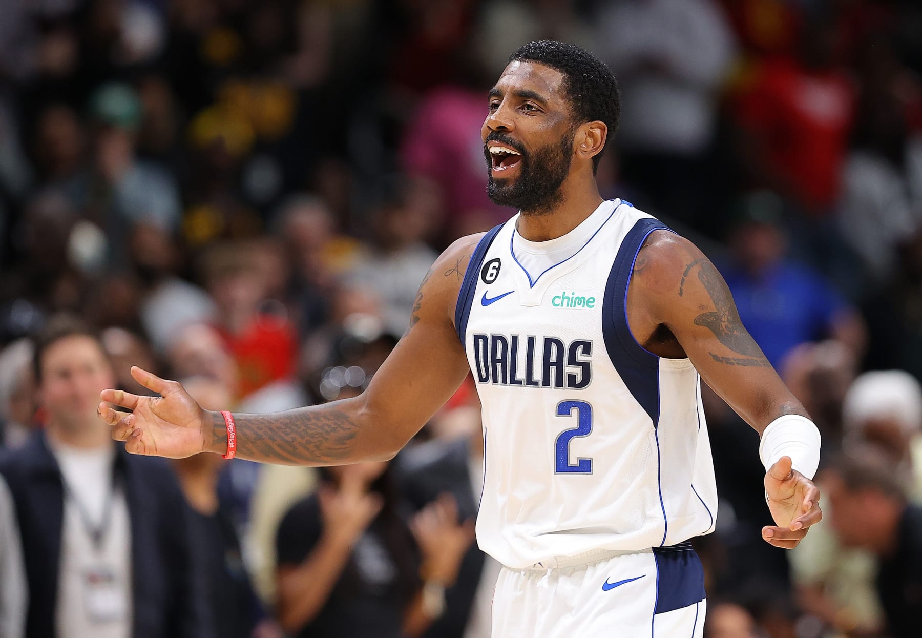 ATLANTA, GEORGIA - APRIL 02:  Kyrie Irving #2 of the Dallas Mavericks reacts after he was charged with a foul against Trae Young #11 of the Atlanta Hawks in the final seconds of overtime at State Farm Arena on April 02, 2023 in Atlanta, Georgia.  NOTE TO USER: User expressly acknowledges and agrees that, by downloading and or using this photograph, User is consenting to the terms and conditions of the Getty Images License Agreement.  (Photo by Kevin C. Cox/Getty Images)