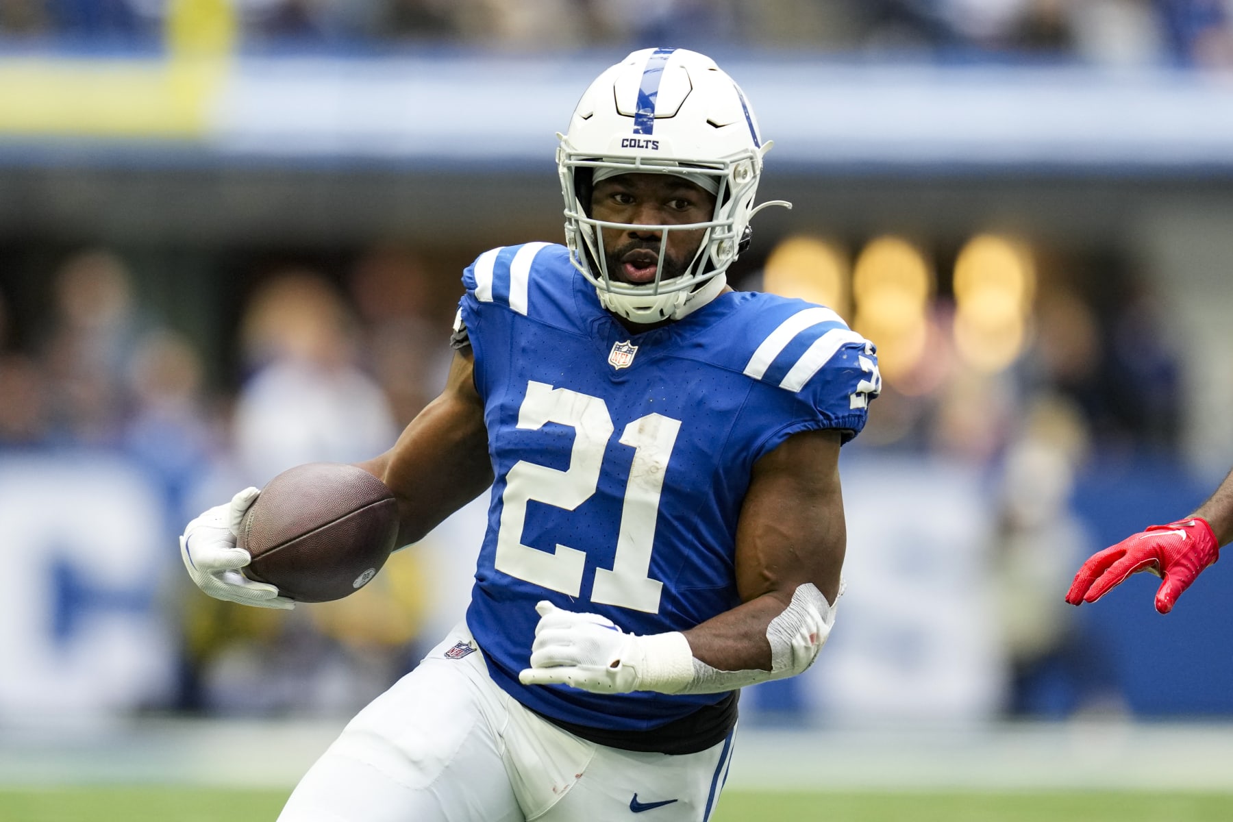 Indianapolis Colts running back Zack Moss (21) runs against the Tennessee Titans during an NFL football game in Indianapolis, Sunday, Oct. 8, 2023. (AP Photo/Michael Conroy)