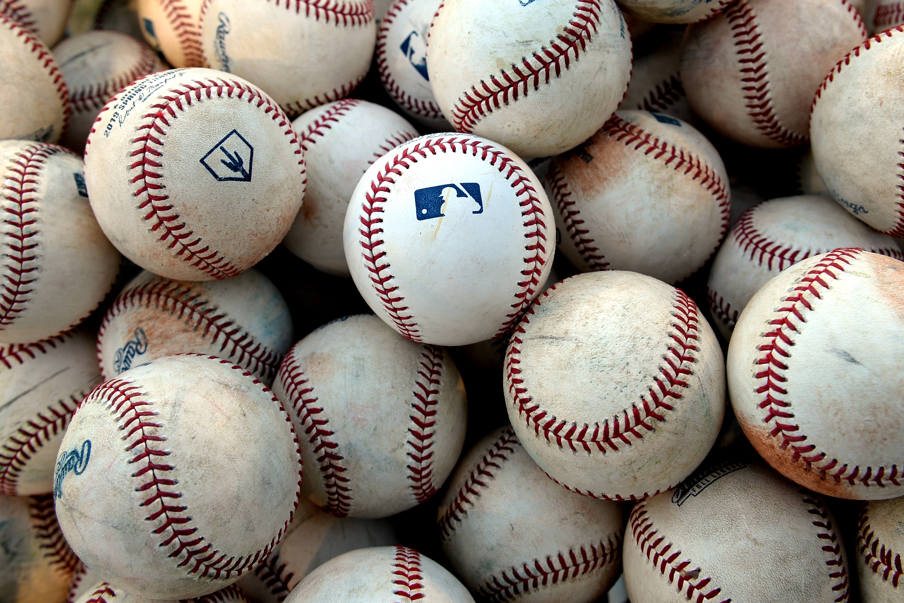MESA, AZ - SEPTEMBER 21: A detail shot of the MLB logo on batting practice balls before the game against the Peoria Javelinas and the Mesa Solar Sox at Sloan Park on Saturday, September 21, 2019 in Mesa, Arizona. (Photo by Jill Weisleder/MLB Photos via Getty Images)