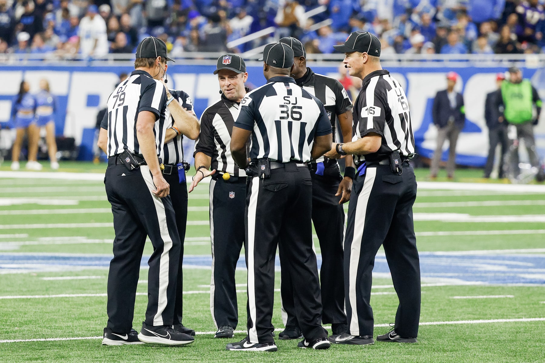 DETROIT, MICHIGAN - JANUARY 07: The referee crew talks during a timeout in the second half of a game between the Minnesota Vikings and the Detroit Lions at Ford Field on January 07, 2024 in Detroit, Michigan. (Photo by Mike Mulholland/Getty Images)