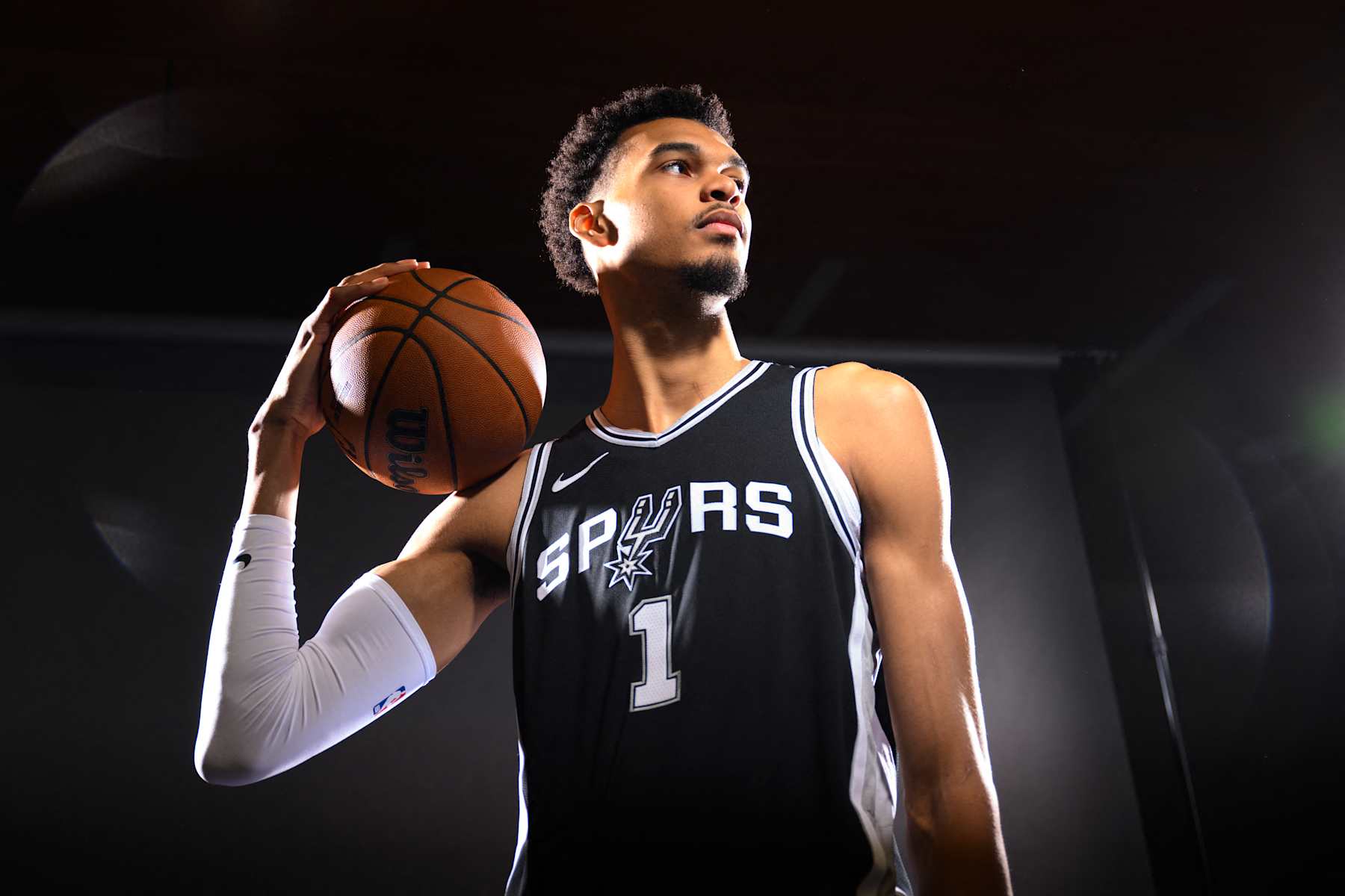 TOPSHOT - San Antonio Spurs forward #01 Victor Wembanyama stands for a portrait during media day ahead of the NBA season at the Victory Capital Performance Center in San Antonio, Texas, September 30, 2024. (Photo by Patrick T. Fallon / AFP) (Photo by PATRICK T. FALLON/AFP via Getty Images)