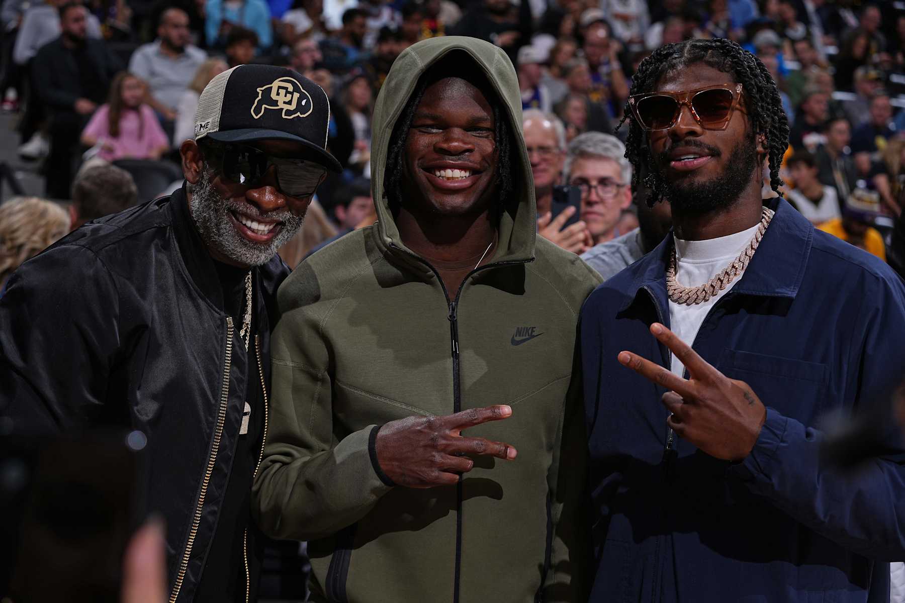 DENVER, CO - OCTOBER 24: Deion Sanders, Travis Hunter, and Sheduer Sanders pose for a photo during the game between the Los Angeles Lakers and the Denver Nuggets on October 24, 2023 at the Ball Arena in Denver, Colorado. NOTE TO USER: User expressly acknowledges and agrees that, by downloading and/or using this Photograph, user is consenting to the terms and conditions of the Getty Images License Agreement. Mandatory Copyright Notice: Copyright 2023 NBAE (Photo by Bart Young/NBAE via Getty Images)