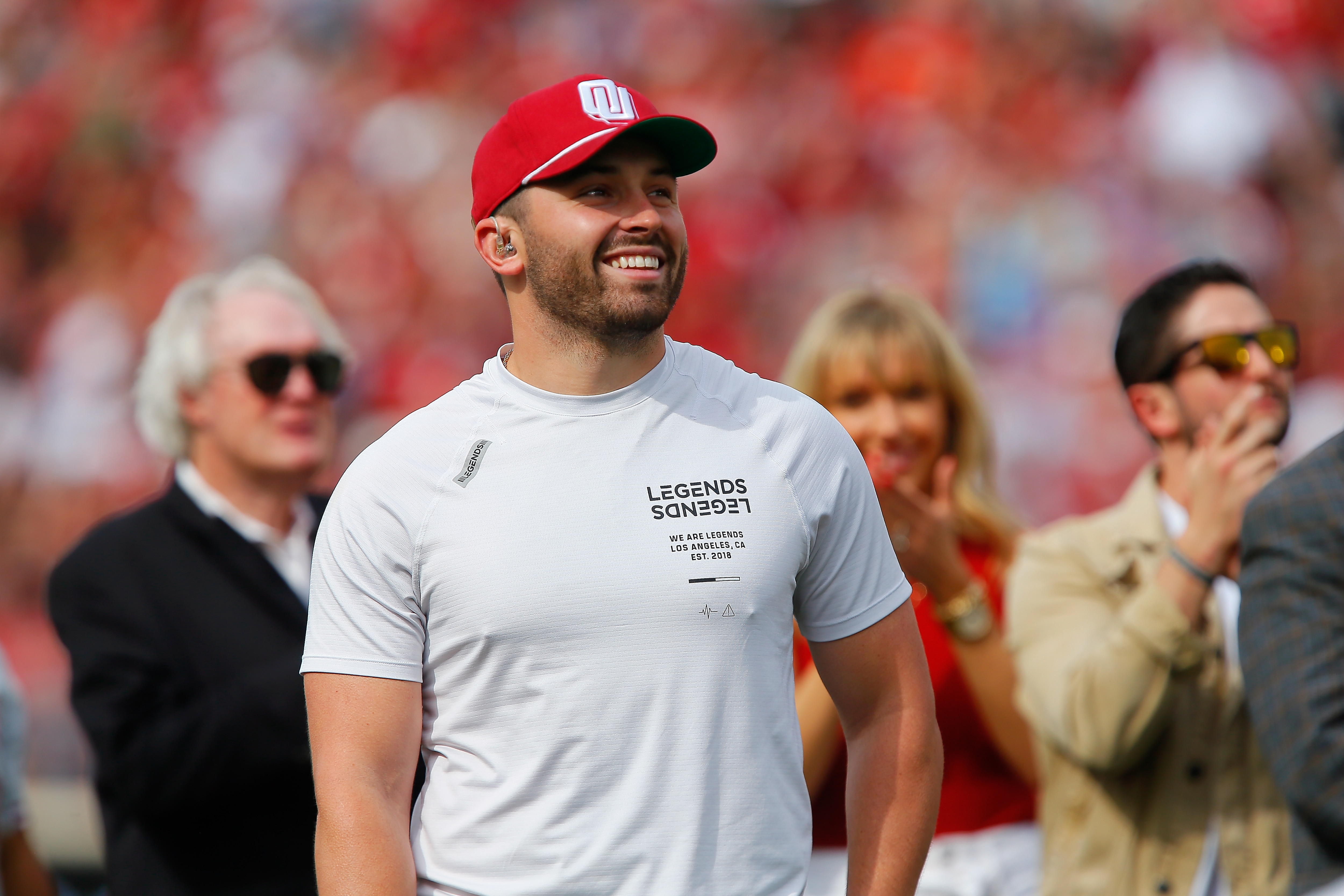 NORMAN, OK - APRIL 23:  Quarterback Baker Mayfield of the Oklahoma Sooners smiles as he is honored with the unveiling of a life-size statue of him during the spring game at Gaylord Family Oklahoma Memorial Stadium on April 23, 2022 in Norman, Oklahoma.   (Photo by Brian Bahr/Getty Images)