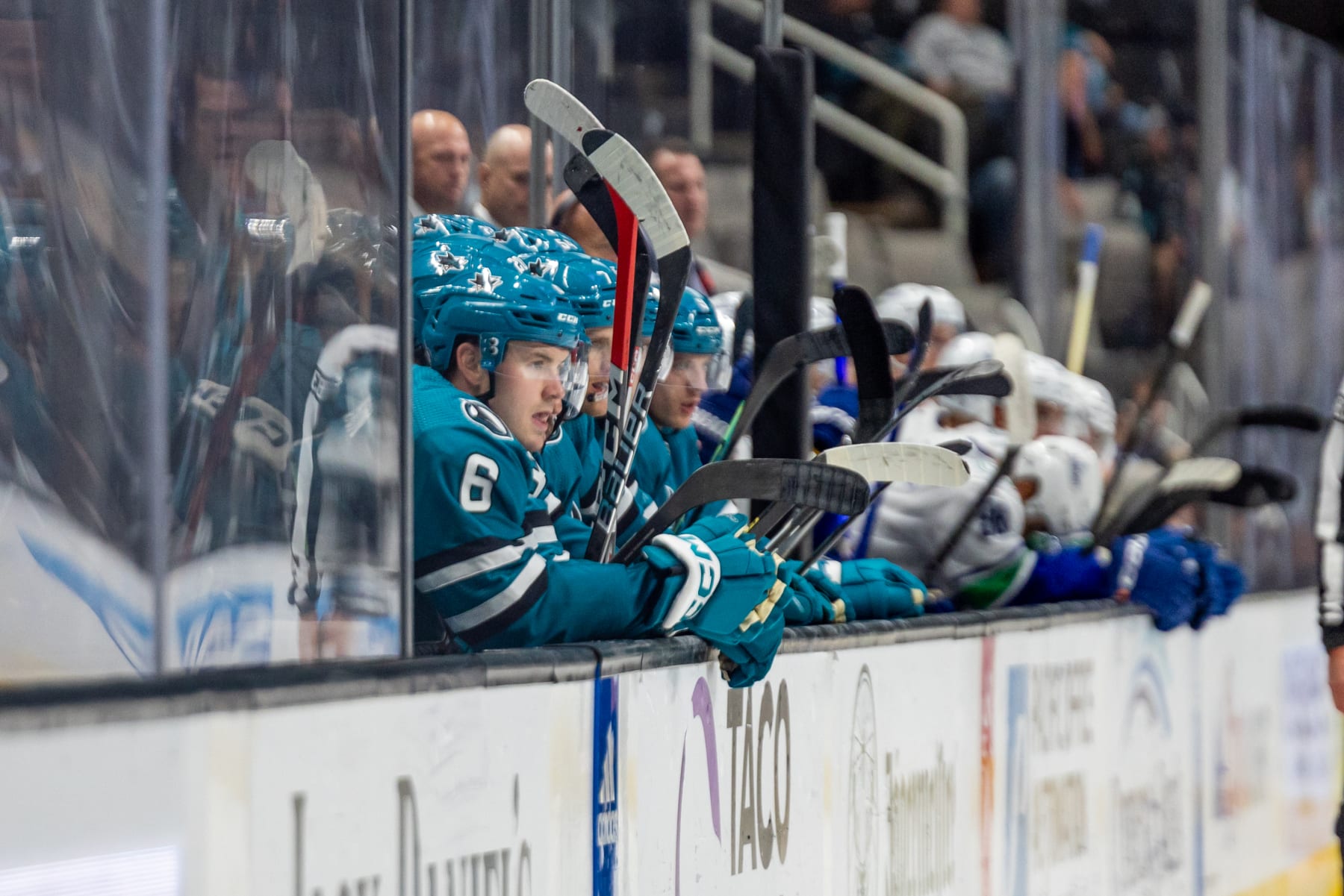 SAN JOSE, CA - NOVEMBER 02: Sharks players watch the action during the NHL professional men's hockey game between the Vancouver Canucks and San Jose Sharks on November 2, 2023 at the SAP Center in San Jose, CA. (Photo by Bob Kupbens/Icon Sportswire via Getty Images)
