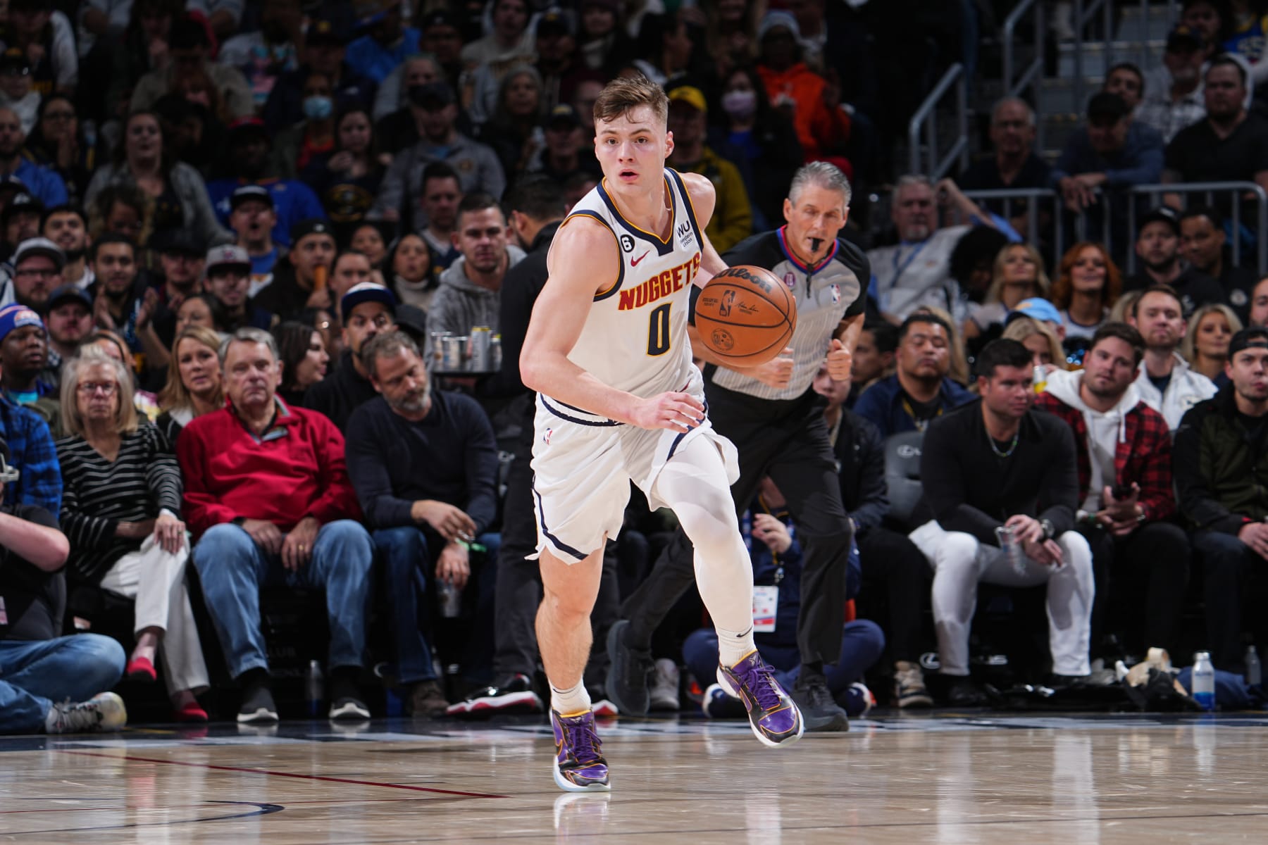 DENVER, CO - DECEMBER 14: Christian Braun #0 of the Denver Nuggets dribbles the ball during the game against the Washington Wizards on December 14, 2022 at the Ball Arena in Denver, Colorado. NOTE TO USER: User expressly acknowledges and agrees that, by downloading and/or using this Photograph, user is consenting to the terms and conditions of the Getty Images License Agreement. Mandatory Copyright Notice: Copyright 2022 NBAE (Photo by Bart Young/NBAE via Getty Images)