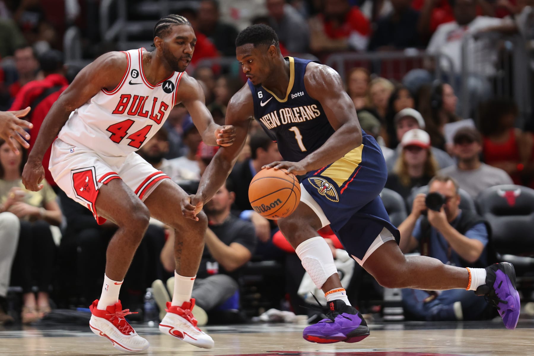 CHICAGO, ILLINOIS - OCTOBER 04: Zion Williamson #1 of the New Orleans Pelicans drives to the basket against Patrick Williams #44 of the Chicago Bulls during the first half of a preseason game at the United Center on October 04, 2022 in Chicago, Illinois.NOTE TO USER: User expressly acknowledges and agrees that, by downloading and or using this photograph, User is consenting to the terms and conditions of the Getty Images License Agreement. (Photo by Michael Reaves/Getty Images)