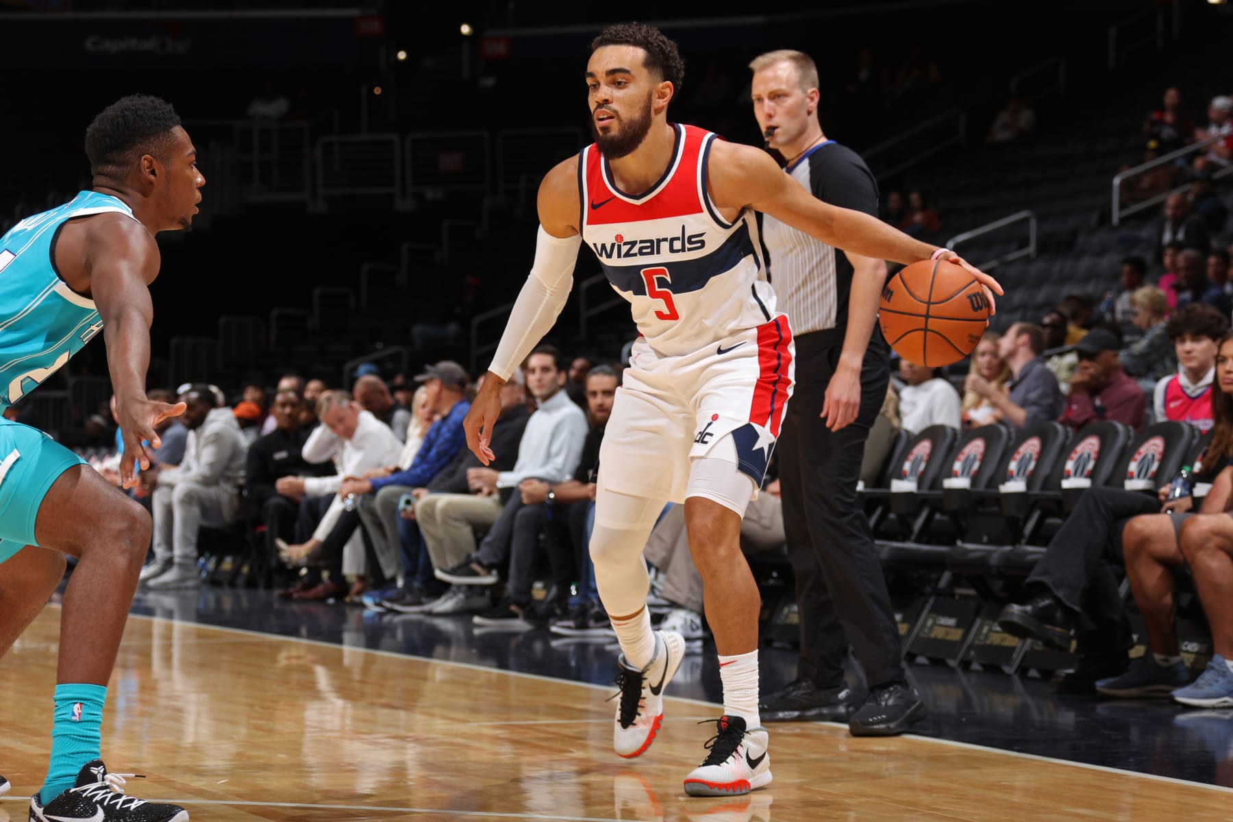 WASHINGTON, DC -  OCTOBER 12: Tyus Jones #5 of the Washington Wizards dribbles the ball during the game against the Charlotte Hornets on October 12, 2023 at Capital One Arena in Washington, DC. NOTE TO USER: User expressly acknowledges and agrees that, by downloading and or using this Photograph, user is consenting to the terms and conditions of the Getty Images License Agreement. Mandatory Copyright Notice: Copyright 2023 NBAE (Photo by Stephen Gosling/NBAE via Getty Images)