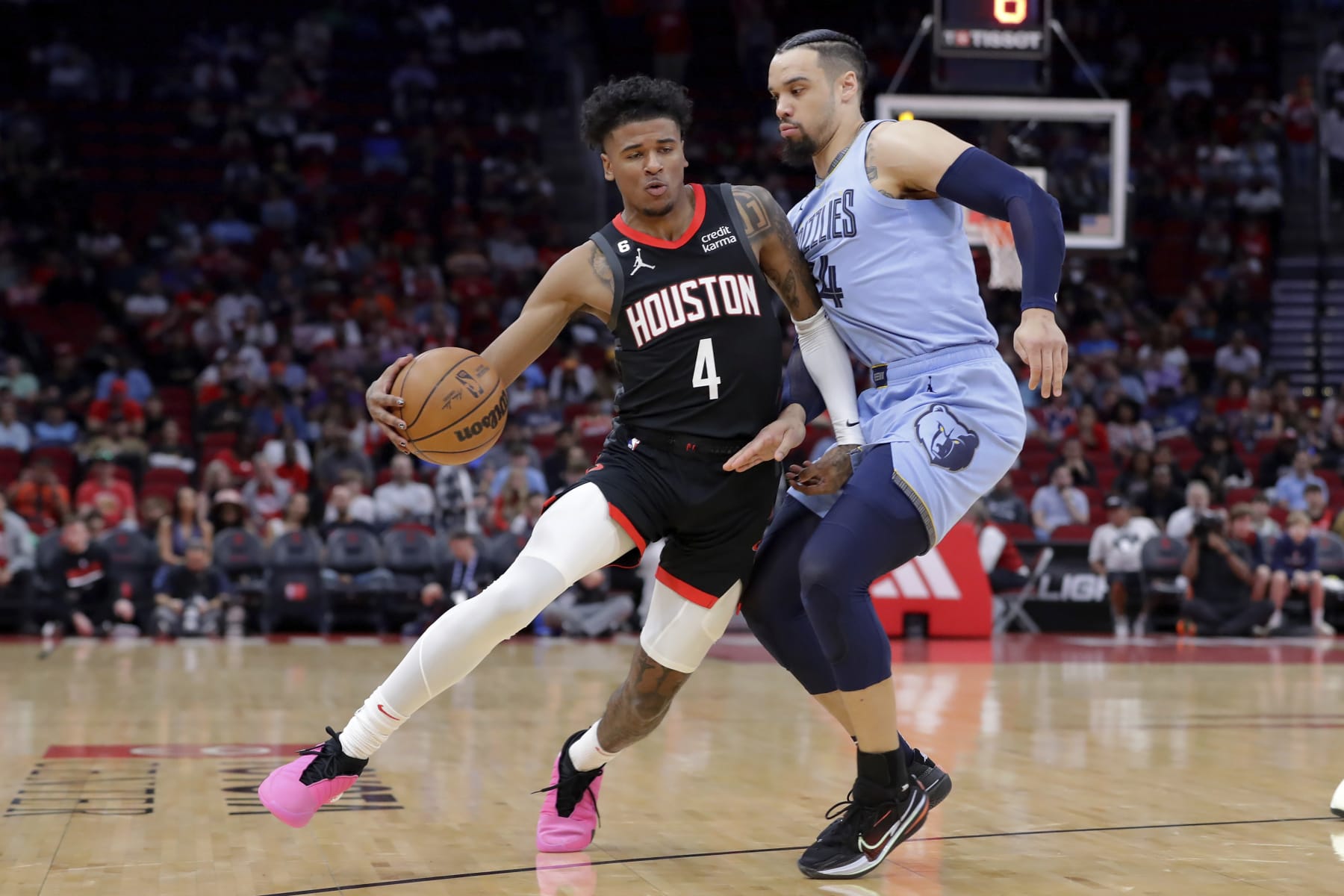 Houston Rockets guard Jalen Green (4) attempts to drive around Memphis Grizzlies forward Dillon Brooks, right, during the first half of an NBA basketball game Wednesday, March 1, 2023, in Houston. (AP Photo/Michael Wyke)