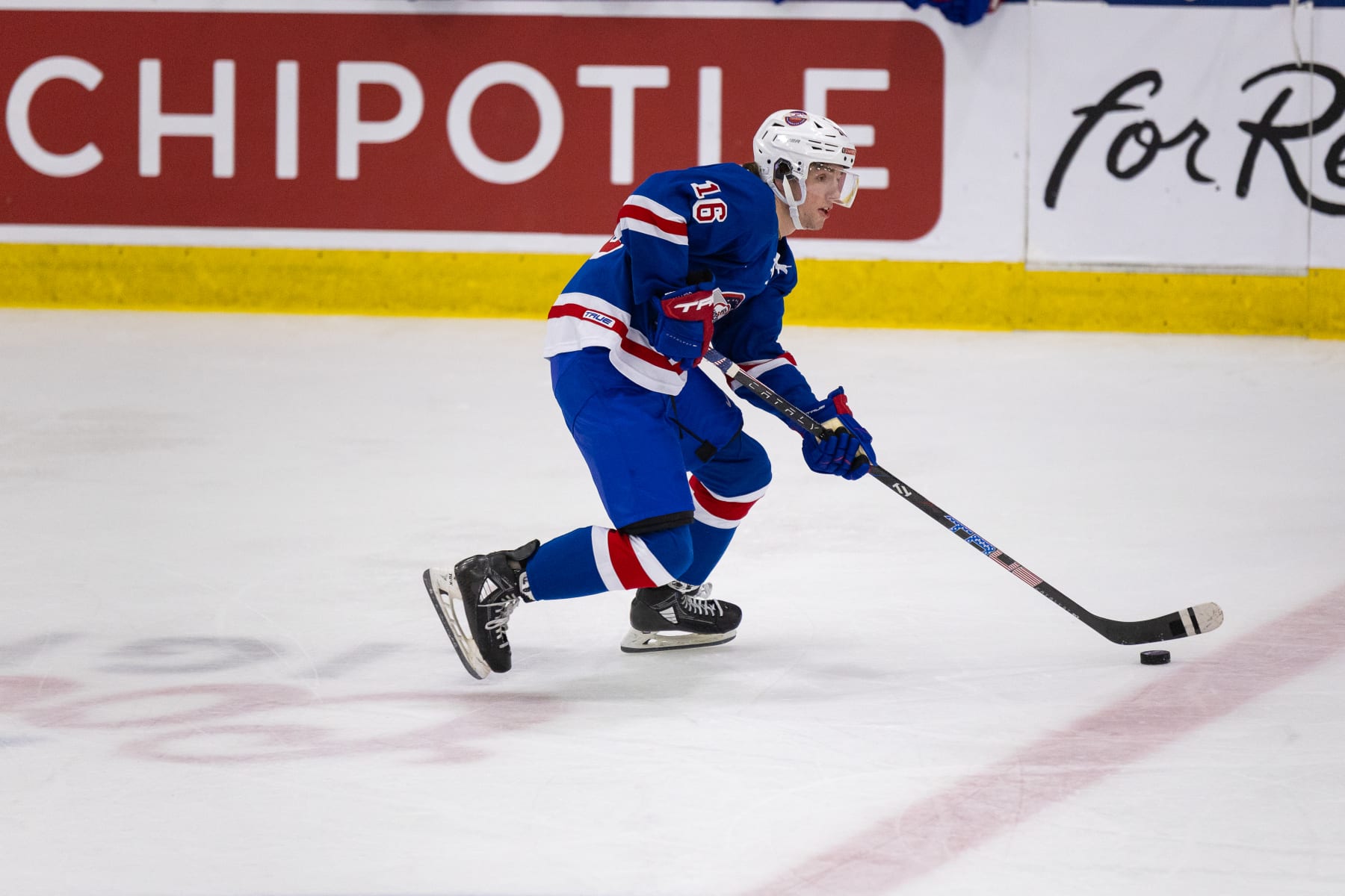 PLYMOUTH, MI - JANUARY 15: Trevor Connelly #16 of Team Blue skates with the puck during Chipotle All-American Game between Team Blue and Team White at USA Hockey Arena on January 15, 2024 in Plymouth, Michigan. (Photo by Michael Miller/ISI Photos/Getty Images)