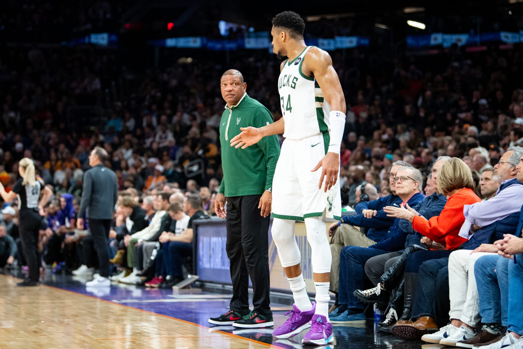 PHOENIX, ARIZONA - FEBRUARY 06: Giannis Antetokounmpo #34 of the Milwaukee Bucks and head coach Doc Rivers talk during the second half of the NBA game against the Phoenix Suns  at Footprint Center on February 06, 2024 in Phoenix, Arizona. The Suns defeated the Bucks 114-106. NOTE TO USER: User expressly acknowledges and agrees that, by downloading and or using this photograph, User is consenting to the terms and conditions of the Getty Images License Agreement.  (Photo by Kelsey Grant/Getty Images)