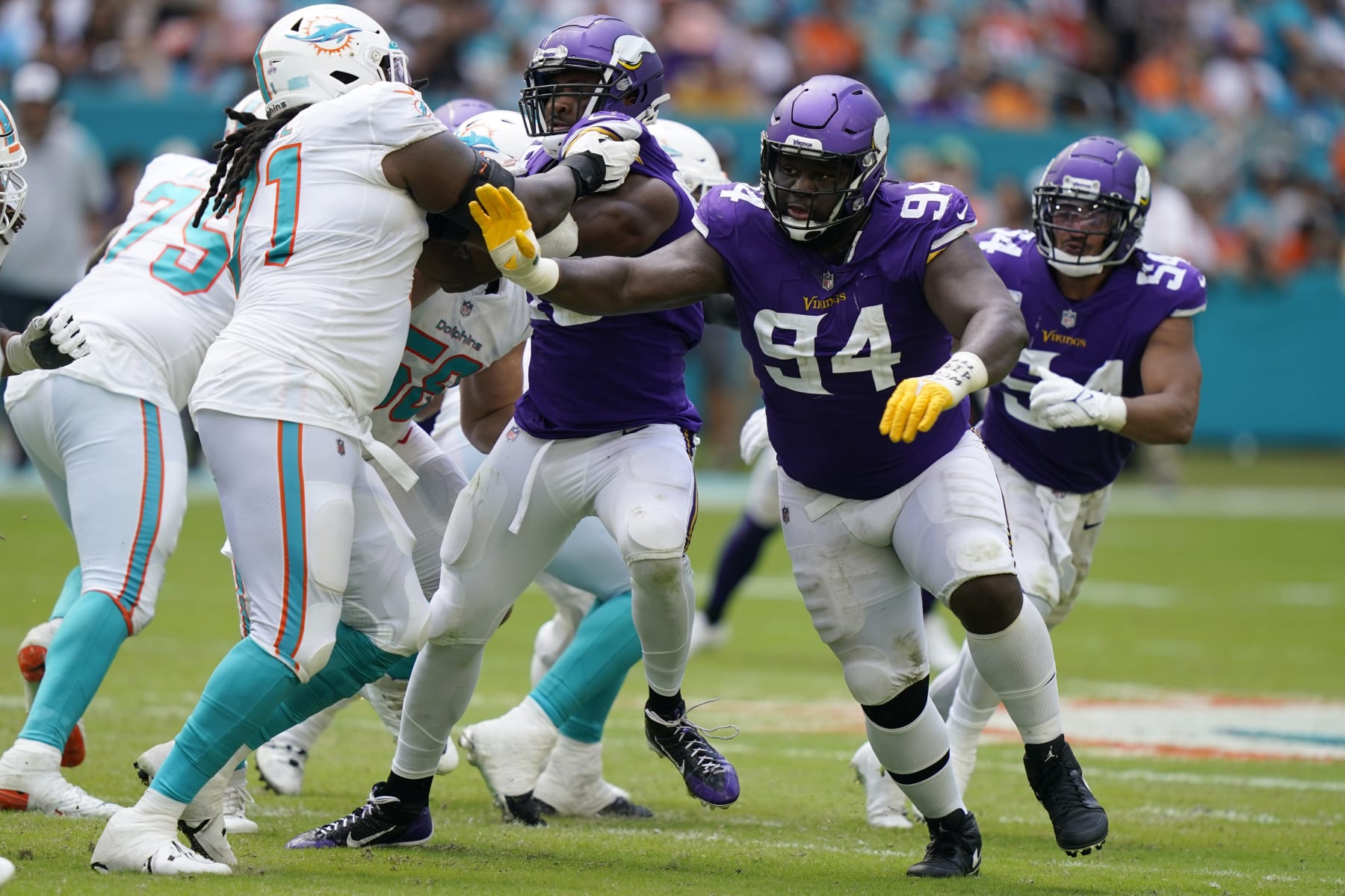 Minnesota Vikings defensive tackle Dalvin Tomlinson (94) defends during the second half of an NFL football game against the Miami Dolphins, Sunday, Oct. 16, 2022, in Miami Gardens, Fla. (AP Photo/Lynne Sladky)