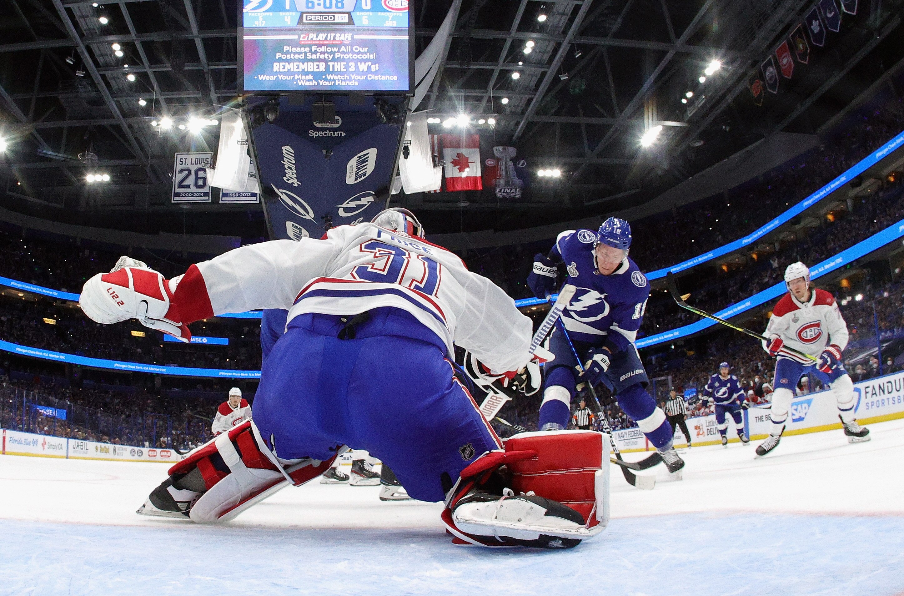 TAMPA, FLORIDA - JUNE 28: Carey Price #31 of the Montreal Canadiens defends against Ondrej Palat #18 of the Tampa Bay Lightning during Game One of the 2021 NHL Stanley Cup Finals against the Tampa Bay Lightning at Amalie Arena on June 28, 2021 in Tampa, Florida. (Photo by Bruce Bennett/Getty Images)