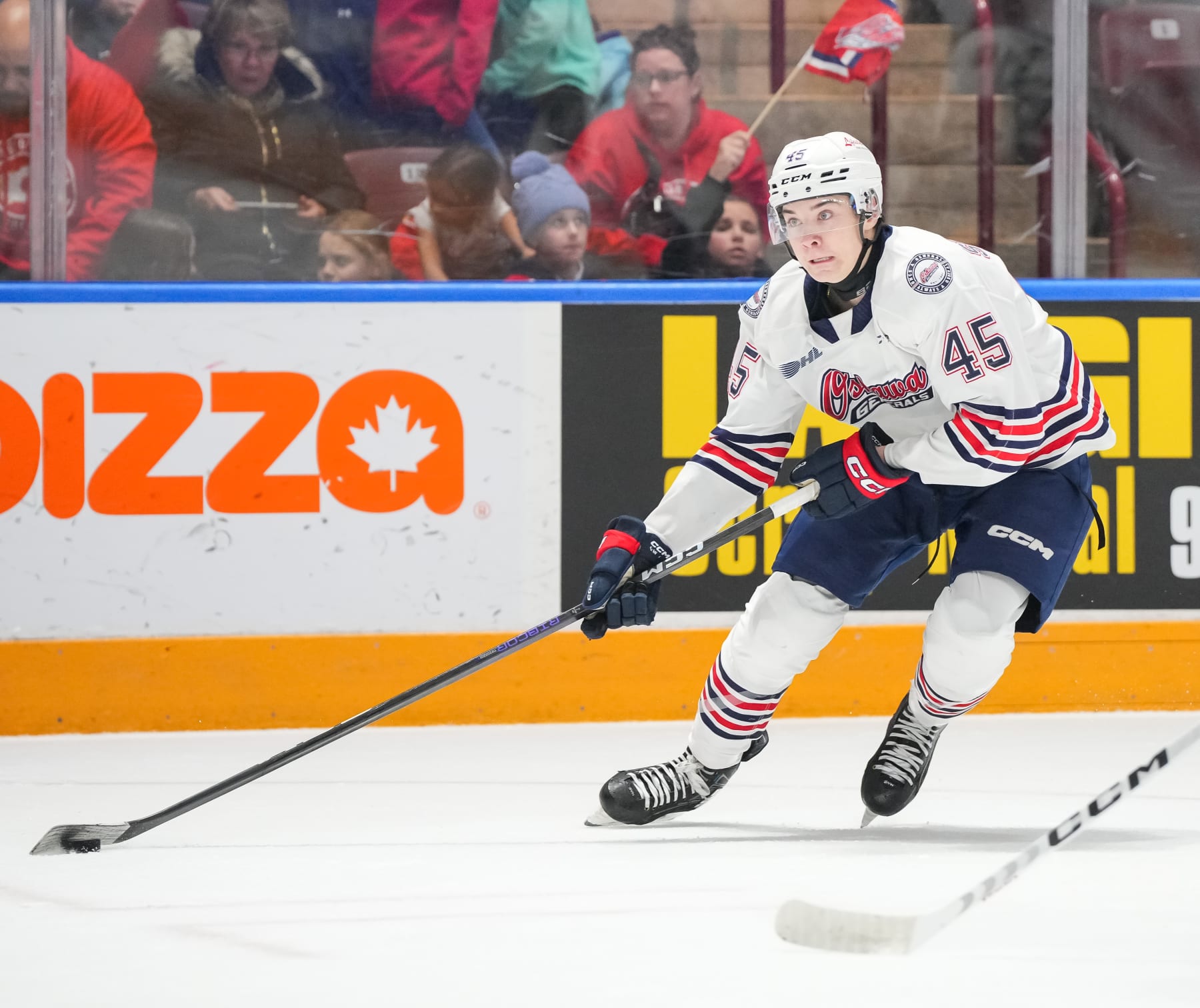 OSHAWA, CANADA - DECEMBER 17: Beckett Sennecke #45 of the Oshawa Generals skates with the puck against Peterborough Petes during the second period at Tribute Communities Centre on December 17, 2023 in Oshawa, Ontario, Canada. (Photo by Chris Tanouye/Getty Images)