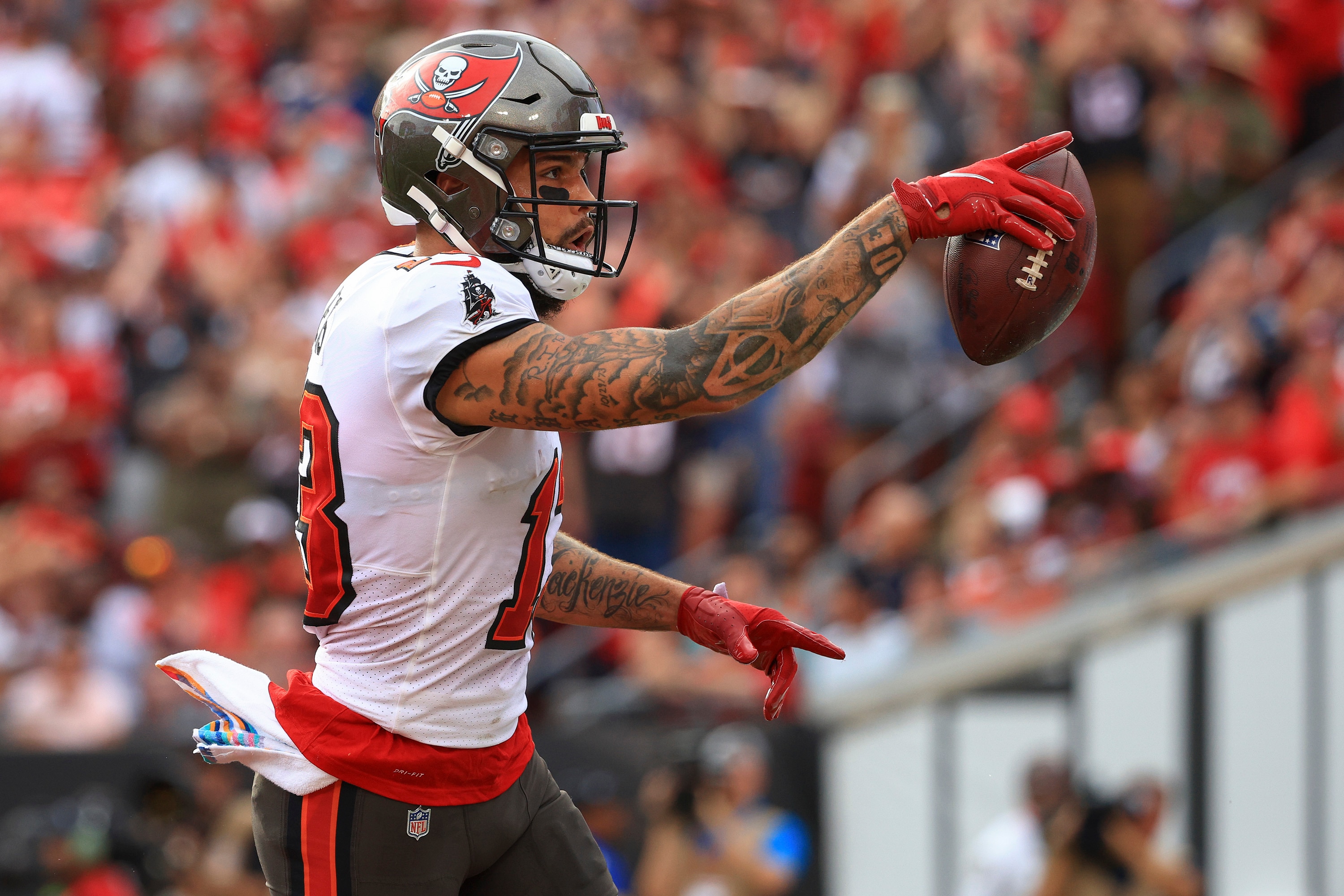 TAMPA, FLORIDA - OCTOBER 24: Mike Evans #13 of the Tampa Bay Buccaneers celebrates after scoring a touchdown in the first quarter against the Chicago Bears in the game at Raymond James Stadium on October 24, 2021 in Tampa, Florida. (Photo by Mike Ehrmann/Getty Images)
