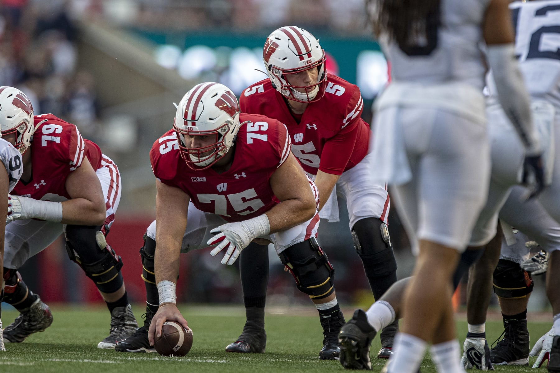 MADISON, WI - SEPTEMBER 04: Wisconsin Badgers offensive lineman Joe Tippmann (75) awaits the snap call from Wisconsin Badgers quarterback Graham Mertz (5) during a college football game between the Penn State Nittany Lions and the Wisconsin Badgers on on September 4th, 2021 at Camp Randall Stadium in Madison, WI. (Photo by Dan Sanger/Icon Sportswire via Getty Images)