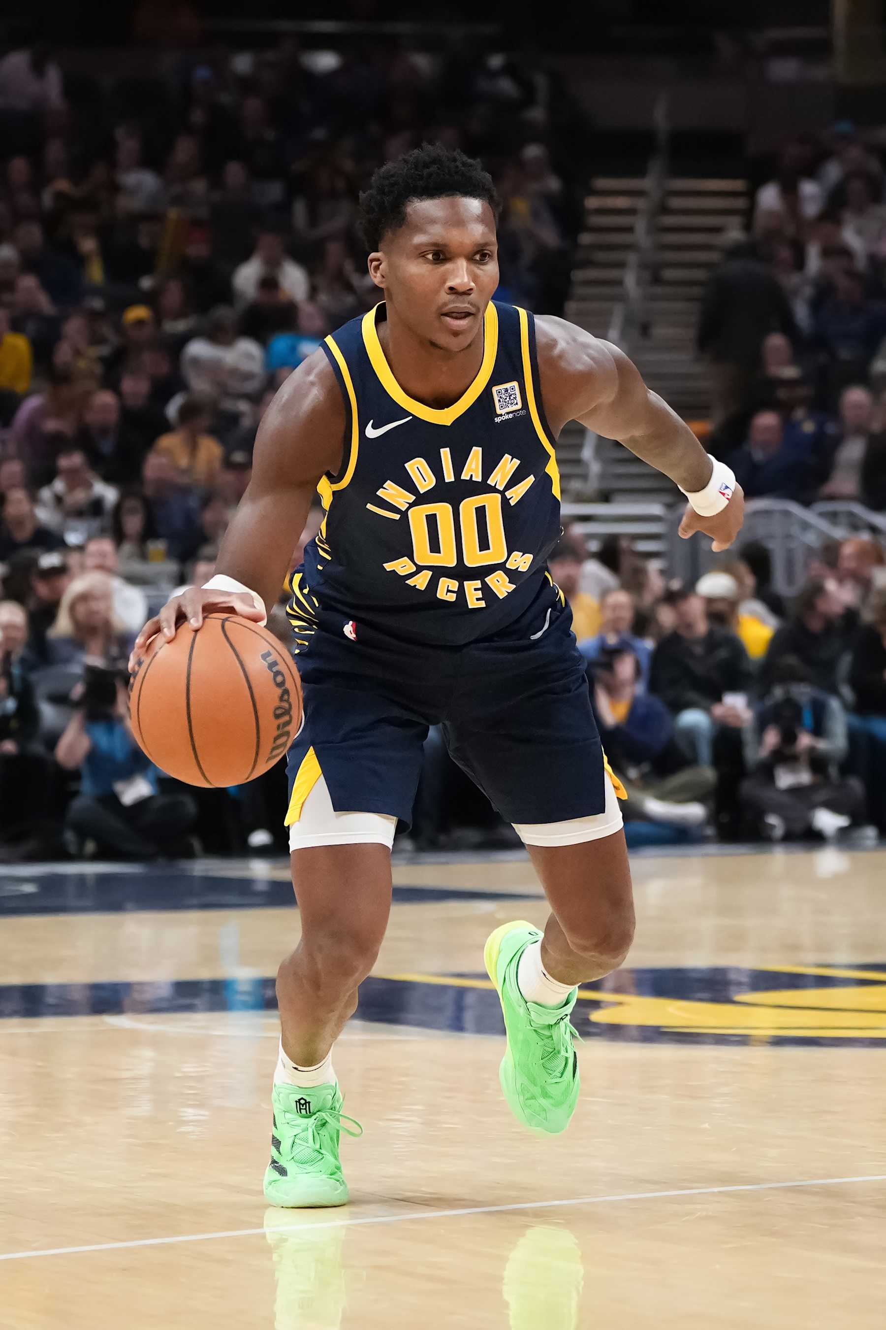 INDIANAPOLIS, INDIANA - NOVEMBER 25: Bennedict Mathurin #00 of the Indiana Pacers dribbles the ball in the first quarter against the New Orleans Pelicans at Gainbridge Fieldhouse on November 25, 2024 in Indianapolis, Indiana. NOTE TO USER: User expressly acknowledges and agrees that, by downloading and or using this photograph, User is consenting to the terms and conditions of the Getty Images License Agreement. (Photo by Dylan Buell/Getty Images)