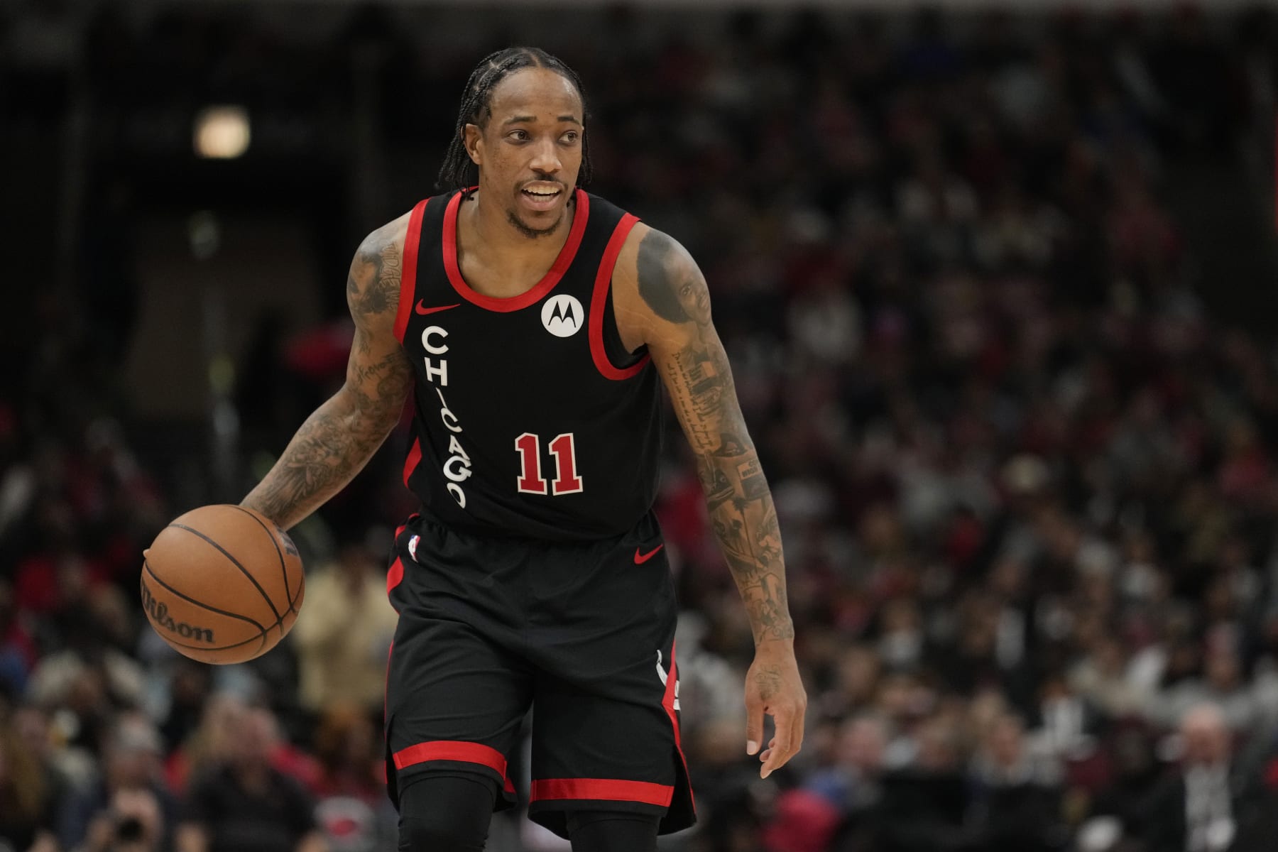 CHICAGO, ILLINOIS - APRIL 01: DeMar DeRozan #11 of the Chicago Bulls dribbles the ball during the second half against the Atlanta Hawks at the United Center on April 01, 2024 in Chicago, Illinois. NOTE TO USER: User expressly acknowledges and agrees that, by downloading and or using this photograph, User is consenting to the terms and conditions of the Getty Images License Agreement. (Photo by Patrick McDermott/Getty Images)