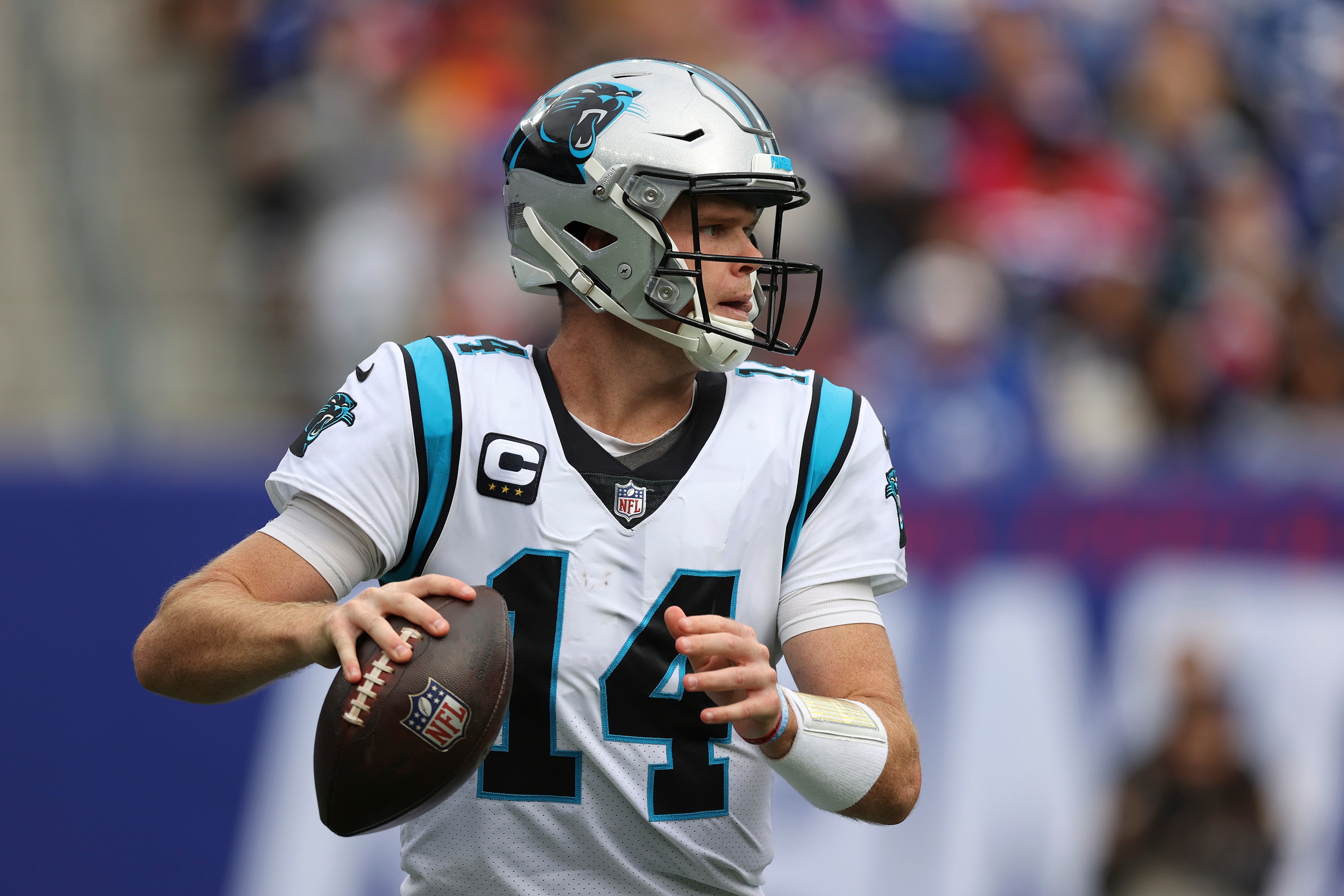 EAST RUTHERFORD, NEW JERSEY - OCTOBER 24: Sam Darnold #14 of the Carolina Panthers throws the ball during the first half in the game against the New York Giants at MetLife Stadium on October 24, 2021 in East Rutherford, New Jersey. (Photo by Al Bello/Getty Images)