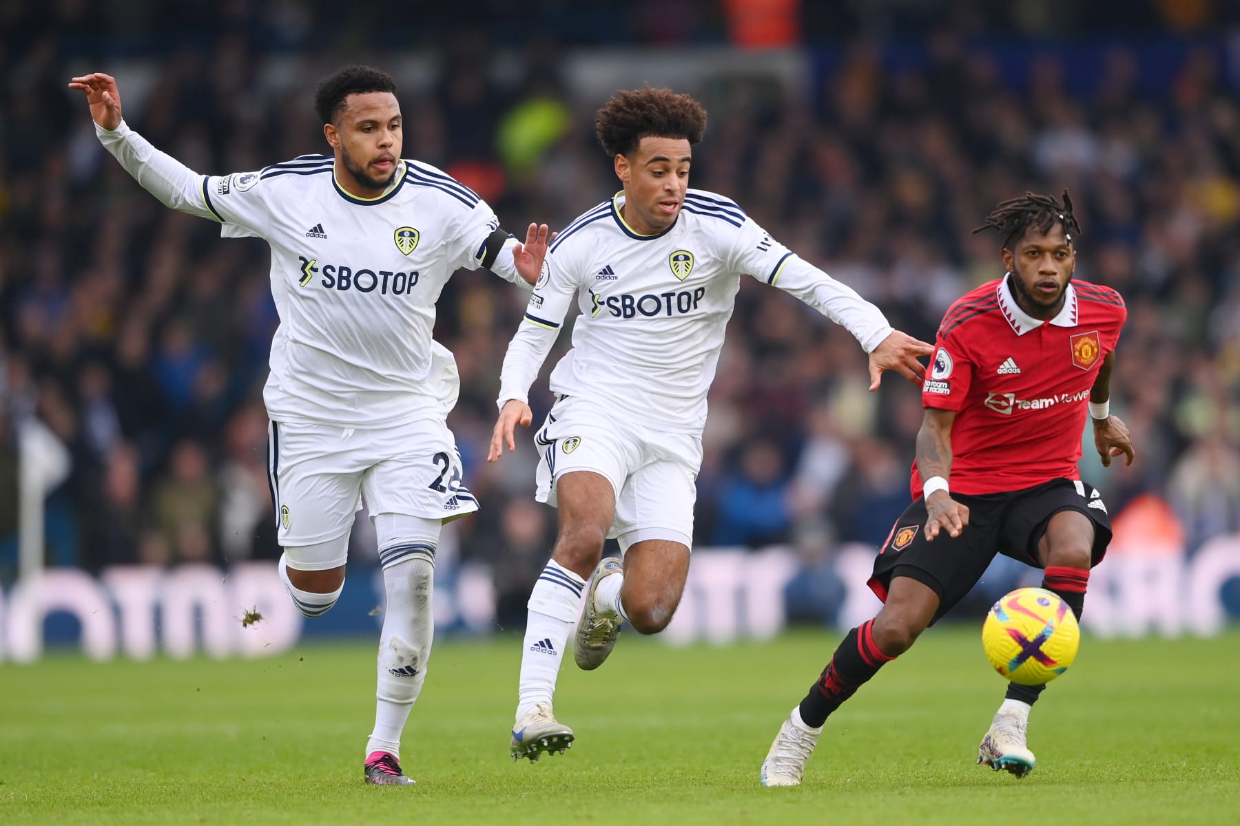 LEEDS, ENGLAND - FEBRUARY 12: (L-R) Weston McKennie and Tyler Adams of Leeds United battles for possession with Fred of Manchester United during the Premier League match between Leeds United and Manchester United at Elland Road on February 12, 2023 in Leeds, England. (Photo by Stu Forster/Getty Images)
