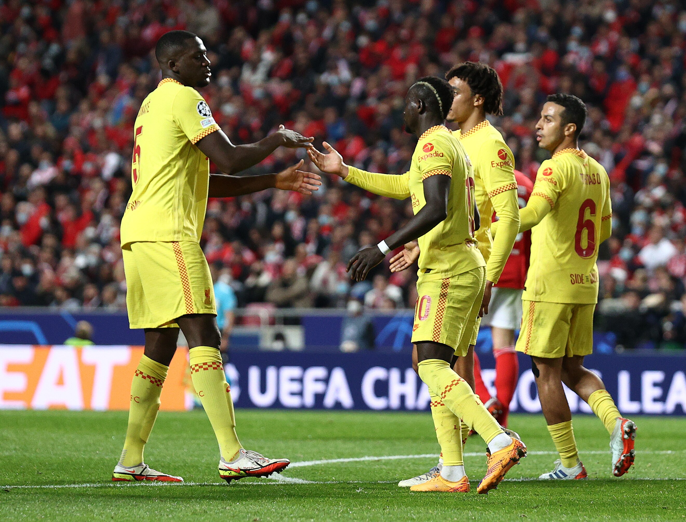 LISBON, PORTUGAL - APRIL 05: Sadio Mane of Liverpool celebrates with teammate Ibrahima Konate after scoring their side's second goal  during the UEFA Champions League Quarter Final Leg One match between SL Benfica and Liverpool FC at Estadio da Luz on April 05, 2022 in Lisbon, Portugal. (Photo by Carlos Rodrigues - UEFA/UEFA via Getty Images)