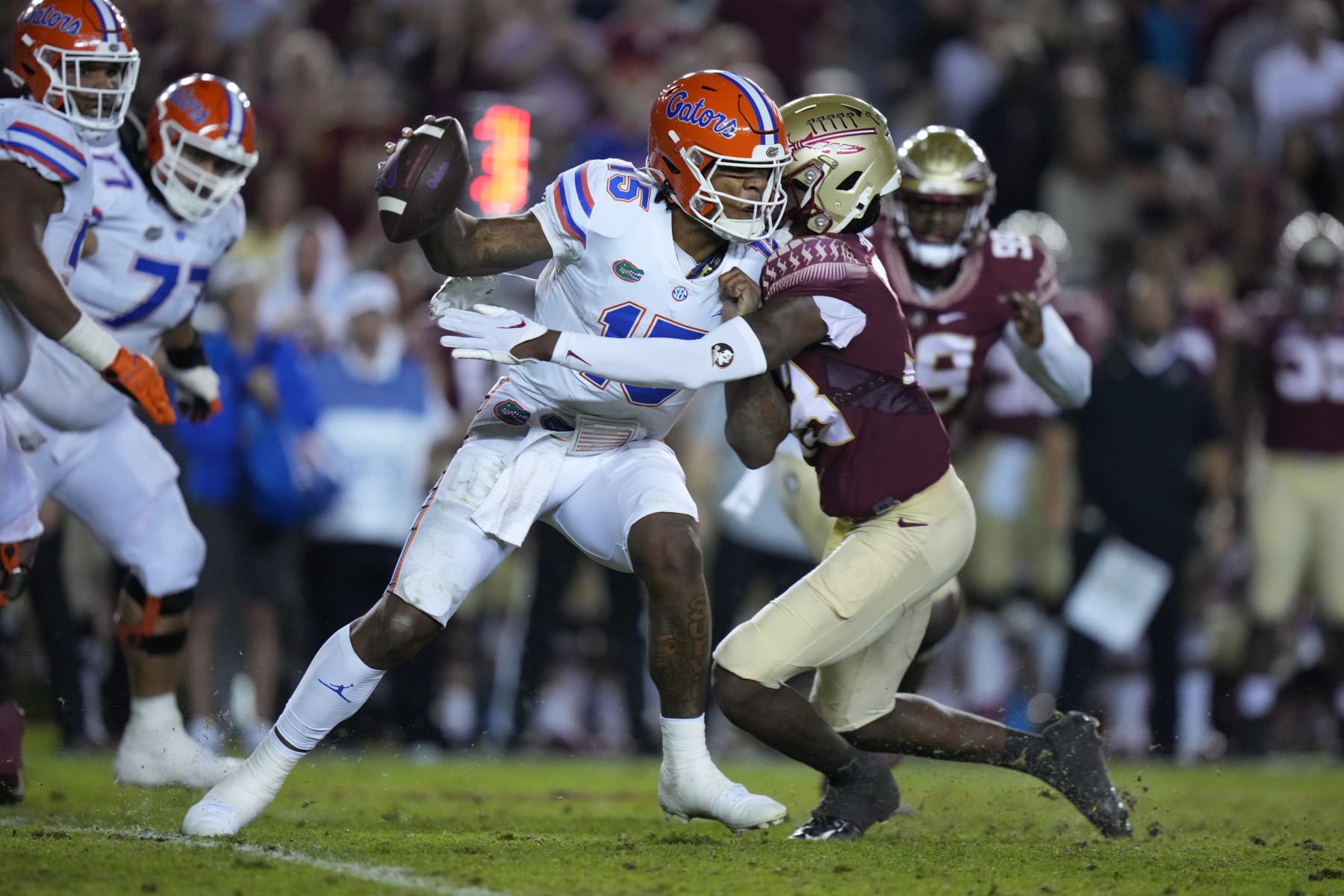 TALLAHASSEE, FL - NOVEMBER 25: Florida Gators quarterback Anthony Richardson (15) gets sacked by Florida State Seminoles defensive back Shyheim Brown (38) during the game between the Florida Gators and the Florida State Seminoles on Friday, November 25, 2022 at Bobby Bowden Field at Doak Campbell Stadium (Photo by Peter Joneleit/Icon Sportswire via Getty Images)