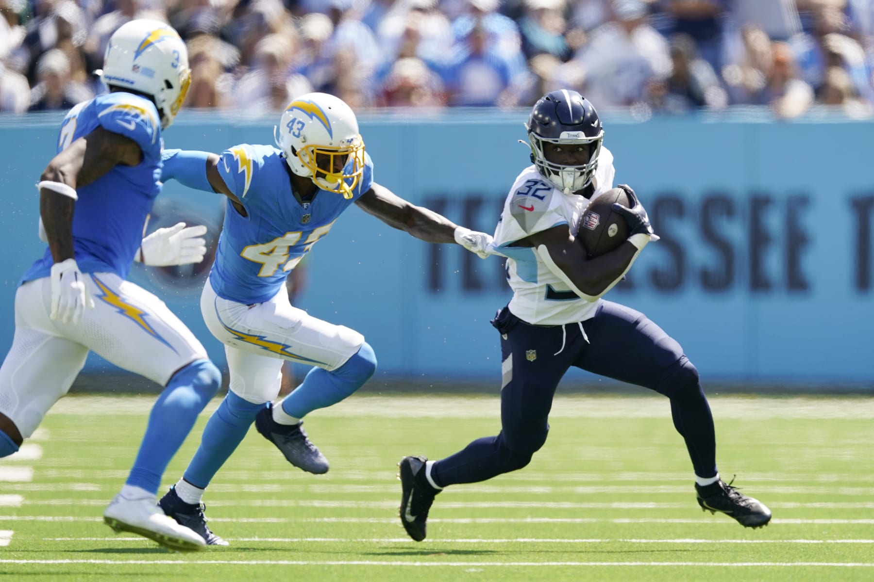 Tennessee Titans running back Tyjae Spears carries past Los Angeles Chargers cornerback Michael Davis (43) during the first half of an NFL football game Sunday, Sept. 17, 2023, in Nashville, Tenn. (AP Photo/George Walker IV)