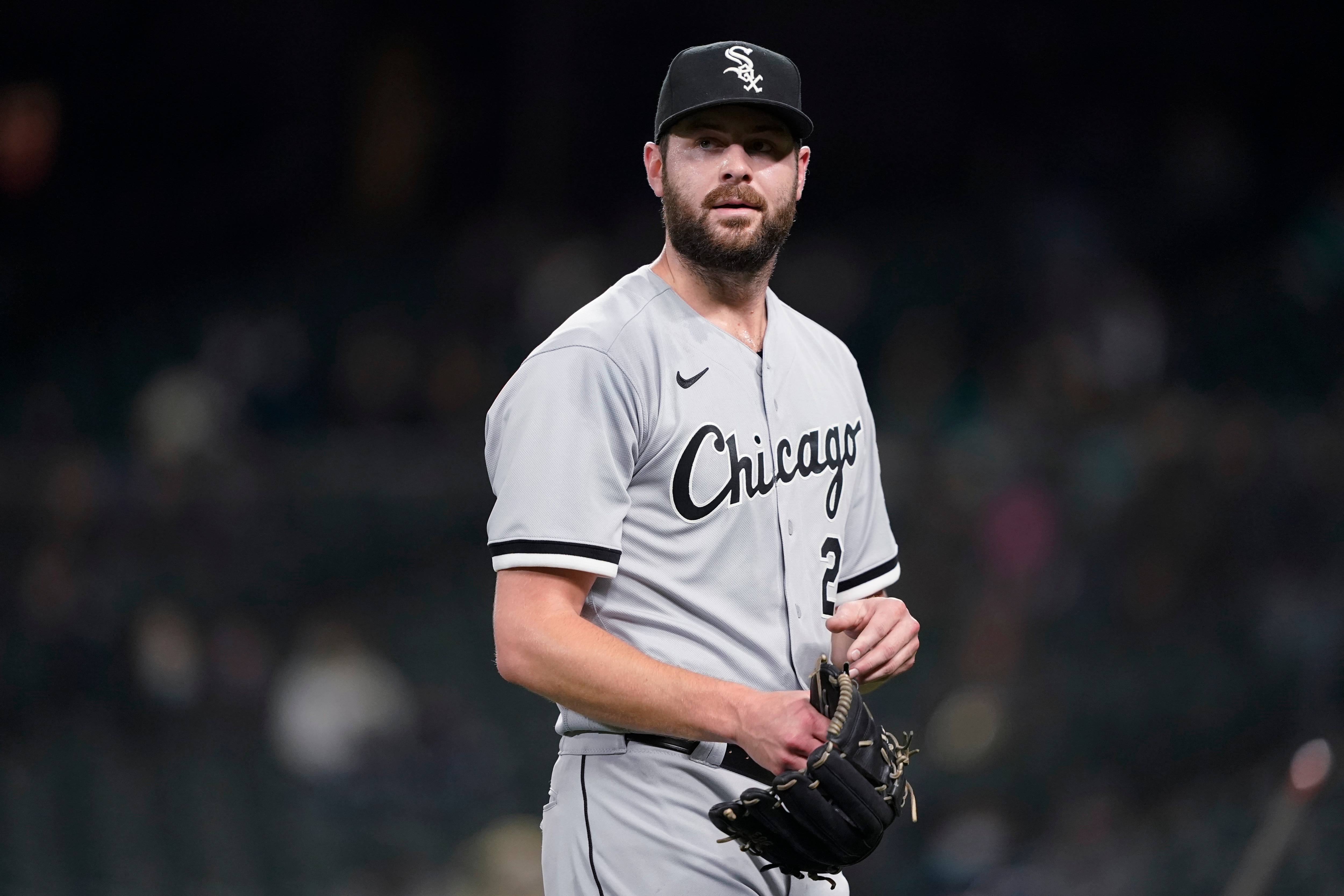 Chicago White Sox starting pitcher Lucas Giolito walks off the field at the end of the third inning of the team's baseball game against the Seattle Mariners, Tuesday, April 6, 2021, in Seattle. (AP Photo/Ted S. Warren)