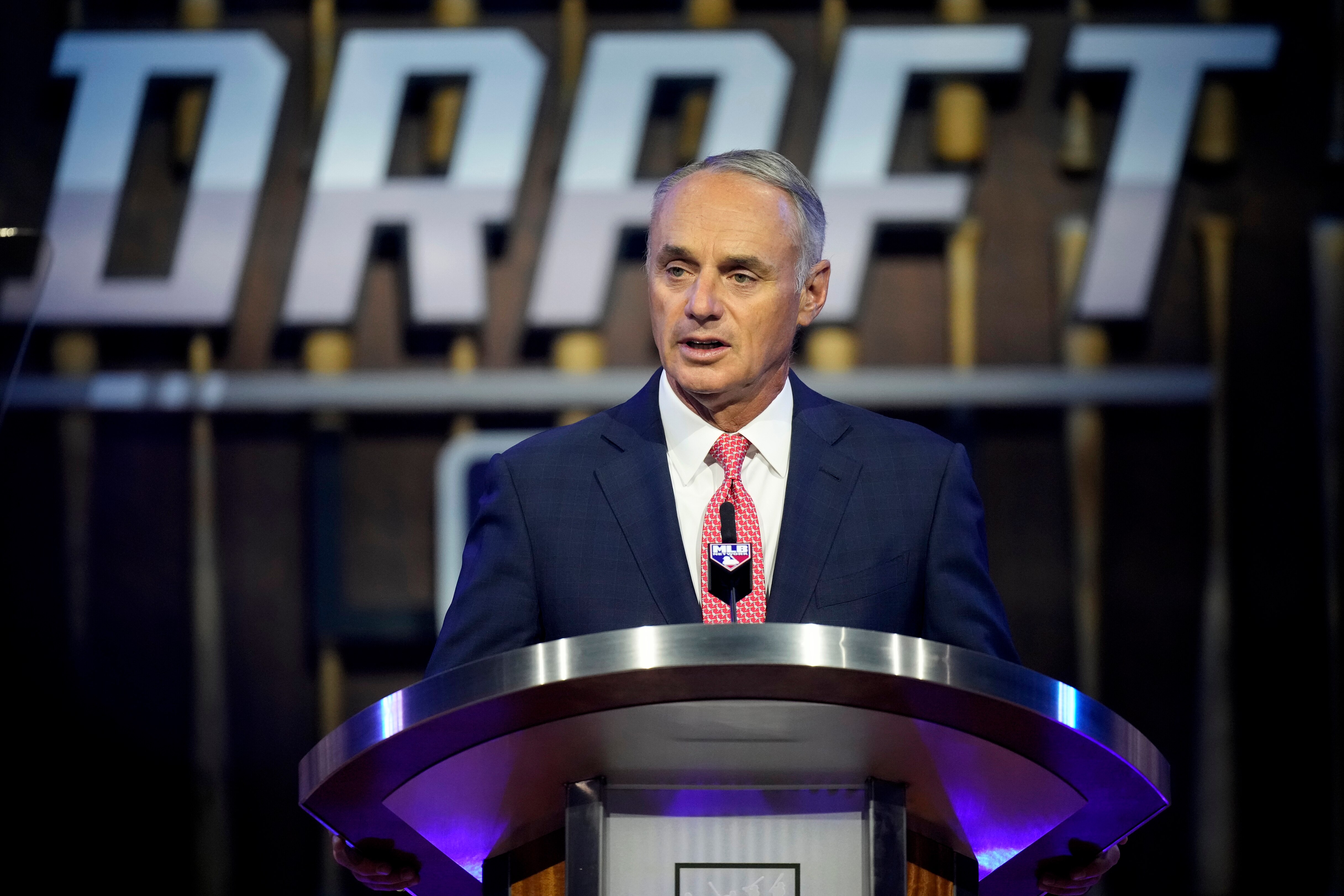 MLB Commissioner Rob Manfred kicks off the first round of the 2021 MLB baseball draft, Sunday, July 11, 2021, in Denver. (AP Photo/David Zalubowski)