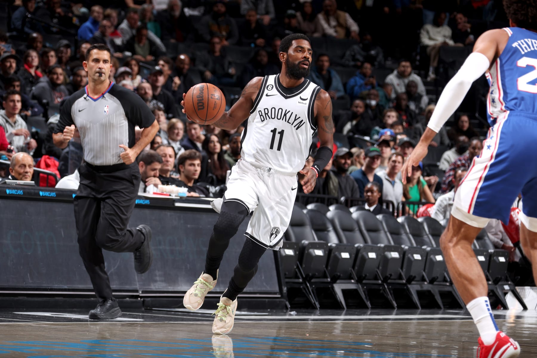 BROOKLYN, NY - OCTOBER 3: Kyrie Irving #11 of the Brooklyn Nets dribbles the ball against the Philadelphia 76ers during a preseason game on October 3, 2022 at Barclays Center in Brooklyn, New York. NOTE TO USER: User expressly acknowledges and agrees that, by downloading and or using this Photograph, user is consenting to the terms and conditions of the Getty Images License Agreement. Mandatory Copyright Notice: Copyright 2022 NBAE (Photo by Nathaniel S. Butler/NBAE via Getty Images)