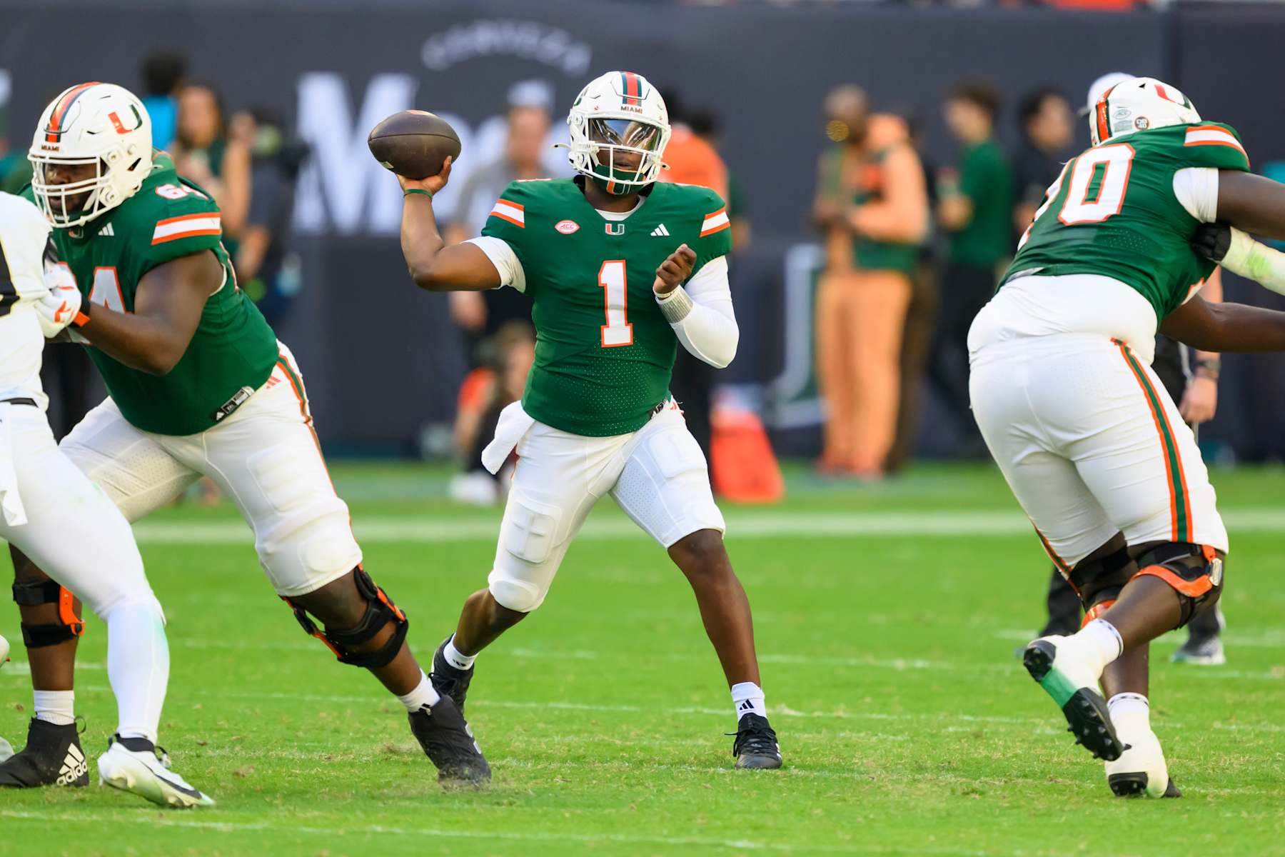 MIAMI GARDENS, FL - NOVEMBER 23: Miami quarterback Cam Ward (1) throws the ball during the college football game between the Wake Forest Deacon Demons and the University of Miami Hurricanes on November 23, 2024 at the Hard Rock Stadium in Miami Gardens, FL. (Photo by Doug Murray/Icon Sportswire via Getty Images)