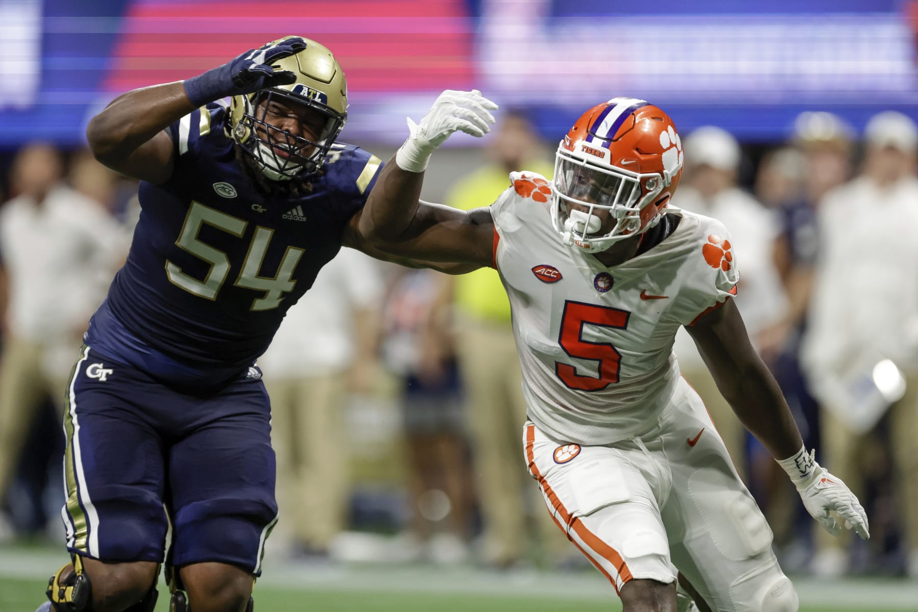 Georgia Tech's Jordan Williams (54) blocks Clemson's K.J. Henry (5) during the first half of an NCAA football game on Monday, Sept. 5, 2022, in Atlanta. (AP Photo/Stew Milne)