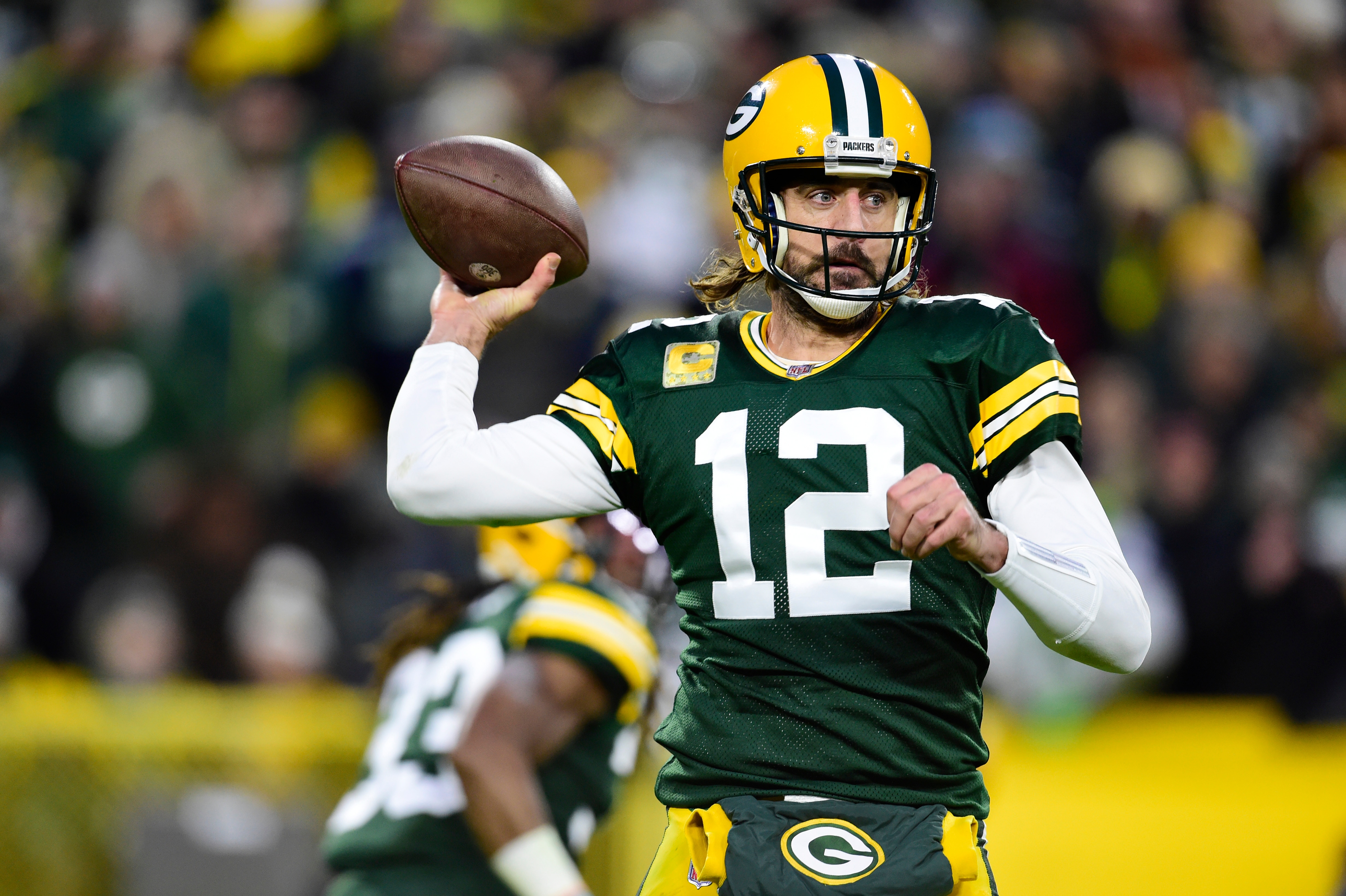 GREEN BAY, WISCONSIN - NOVEMBER 14: Aaron Rodgers #12 of the Green Bay Packers looks to pass the ball during the first half against the Seattle Seahawks at Lambeau Field on November 14, 2021 in Green Bay, Wisconsin. (Photo by Patrick McDermott/Getty Images)