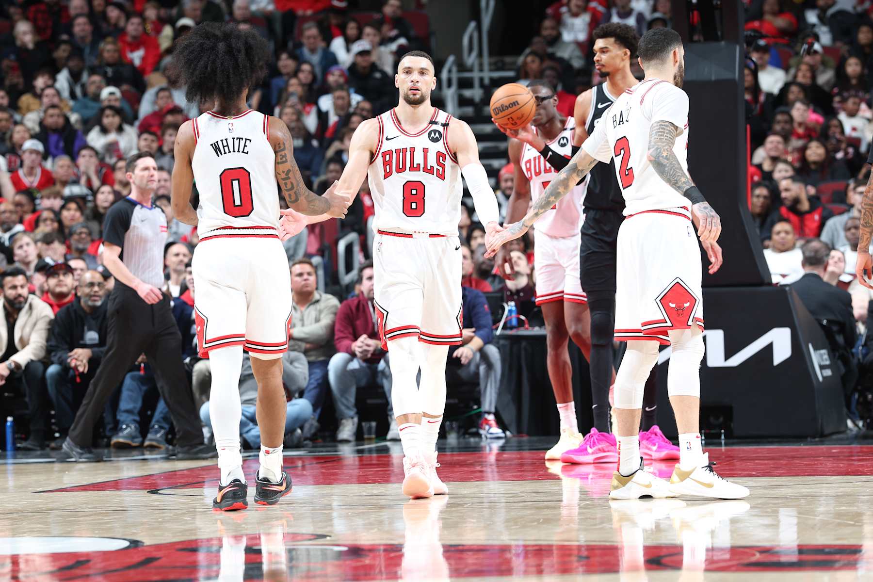 CHICAGO, IL - JANUARY 6:  Zach LaVine #8 and Lonzo Ball #2 of the Chicago Bulls high five during the game against the San Antonio Spurs on January 6, 2025 at United Center in Chicago, Illinois. NOTE TO USER: User expressly acknowledges and agrees that, by downloading and or using this photograph, User is consenting to the terms and conditions of the Getty Images License Agreement. Mandatory Copyright Notice: Copyright 2025 NBAE (Photo by Jeff Haynes/NBAE via Getty Images)