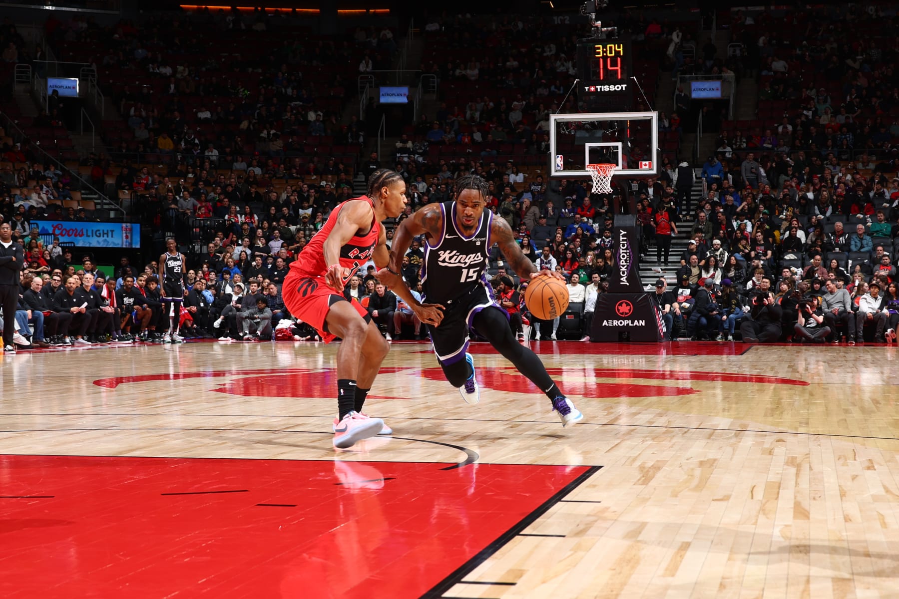 TORONTO, CANADA - MARCH 20: Davion Mitchell #15 of the Sacramento Kings drives to the basket during the game against the Toronto Raptors on March 20, 2024 at the Scotiabank Arena in Toronto, Ontario, Canada.  NOTE TO USER: User expressly acknowledges and agrees that, by downloading and or using this Photograph, user is consenting to the terms and conditions of the Getty Images License Agreement.  Mandatory Copyright Notice: Copyright 2024 NBAE (Photo by Vaughn Ridley/NBAE via Getty Images)