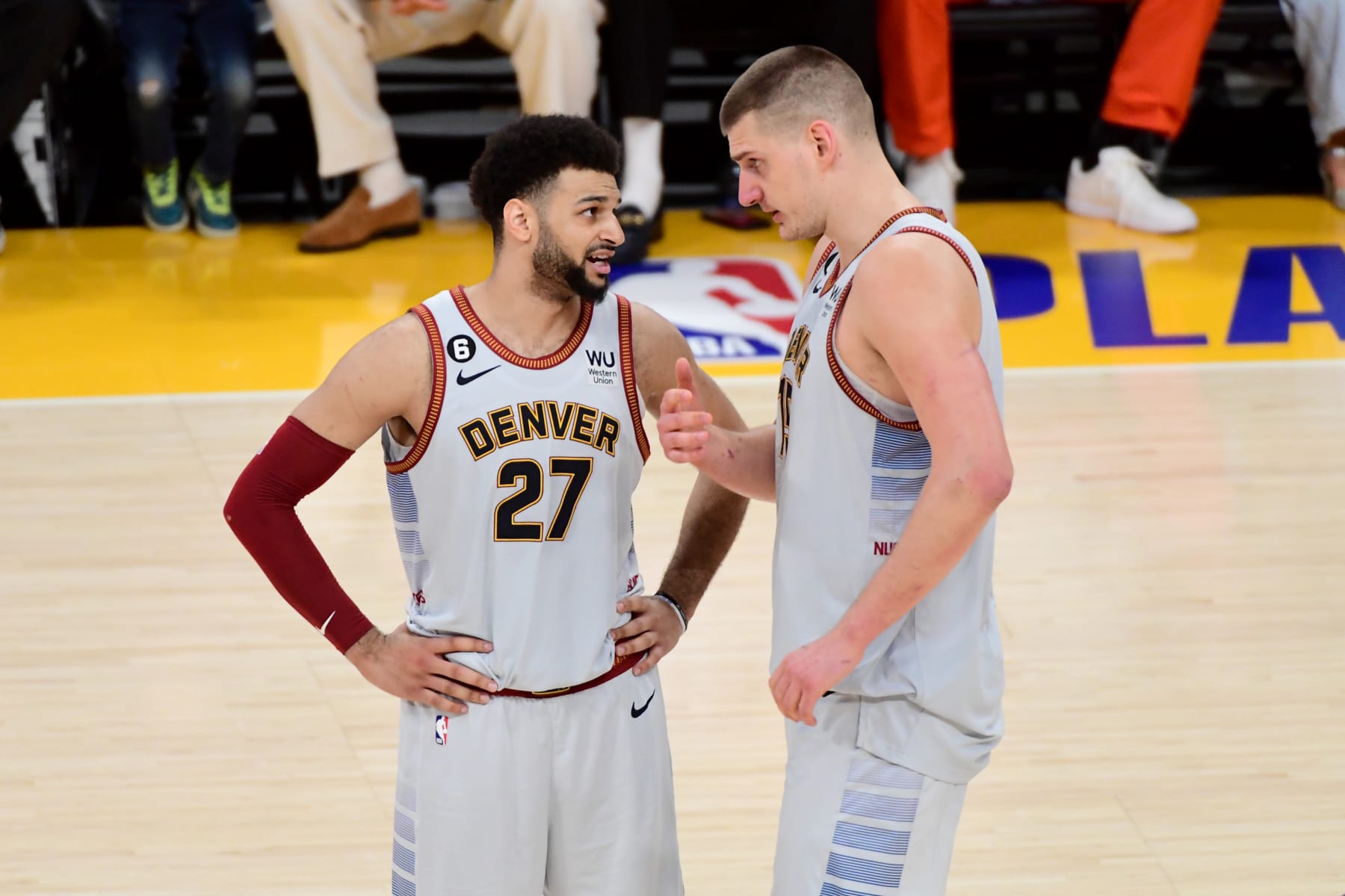 LOS ANGELES, CA - MAY 22: Jamal Murray #27 of the Denver Nuggets talks with Nikola Jokic #15 of the Denver Nuggets during Game 4 of the 2023 NBA Playoffs Western Conference Finals on May 22, 2023 at Crypto.Com Arena in Los Angeles, California. NOTE TO USER: User expressly acknowledges and agrees that, by downloading and/or using this Photograph, user is consenting to the terms and conditions of the Getty Images License Agreement. Mandatory Copyright Notice: Copyright 2023 NBAE (Photo by Adam Pantozzi/NBAE via Getty Images)