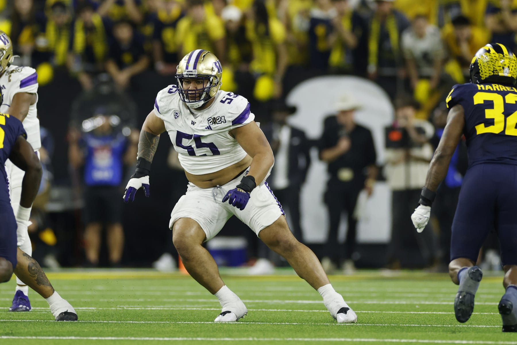 HOUSTON, TX - JANUARY 08: Washington Huskies offensive lineman Troy Fautanu (55) blocks during the CFP National Championship against the Michigan Wolverines on January 08, 2024 at NRG Stadium in Houston, Texas. (Photo by Joe Robbins/Icon Sportswire via Getty Images)